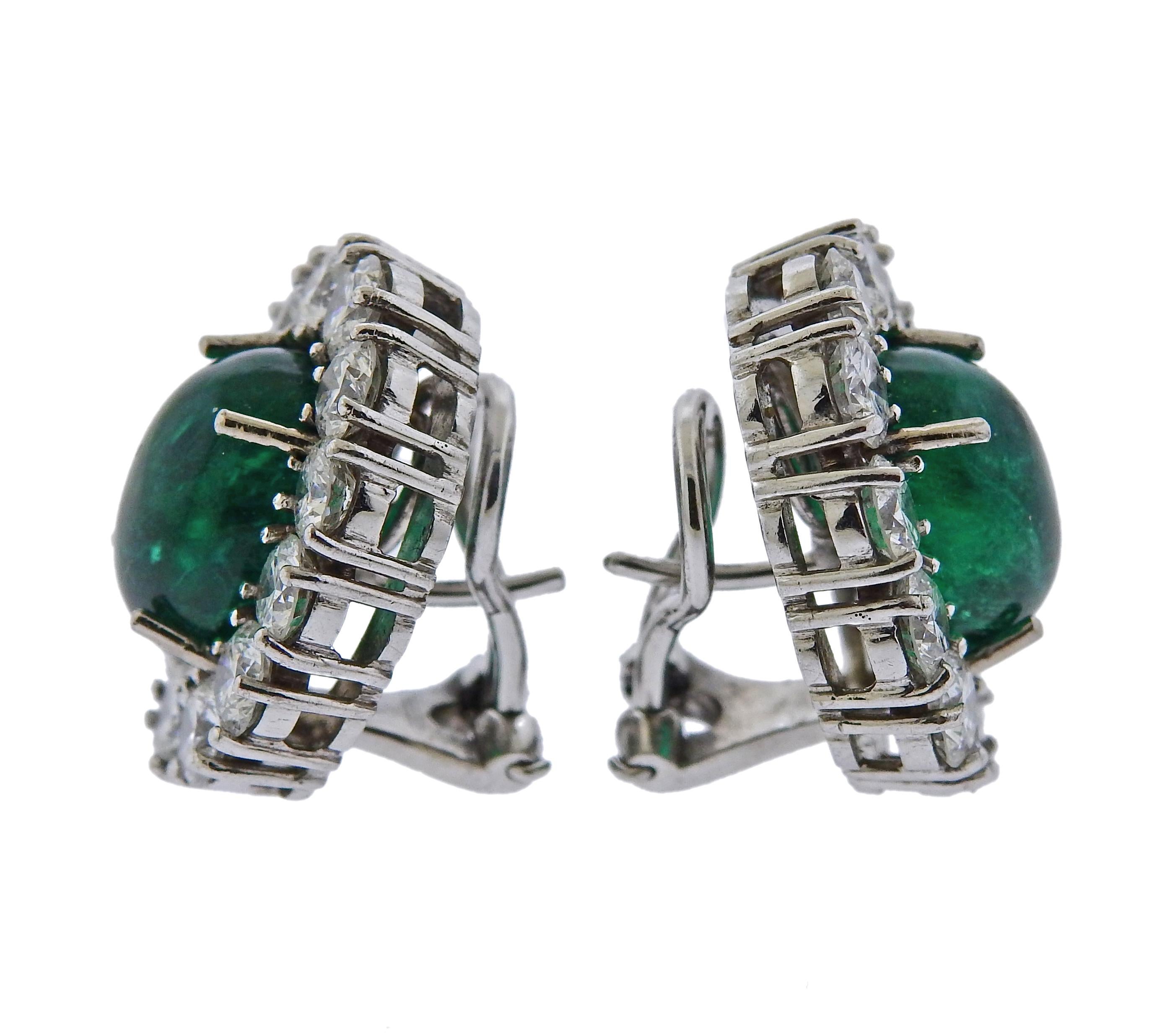 Pair of 18k white gold cocktail earrings, set each with an approx. 5 carats oval emerald cabochon, measuring 12.1mm x 9.7mm x 6.7mm, surrounded with a total of approx. 4.40ctw in diamonds.  Earrings measure approx. 22mm x 18mm. Marked 750. Weigh