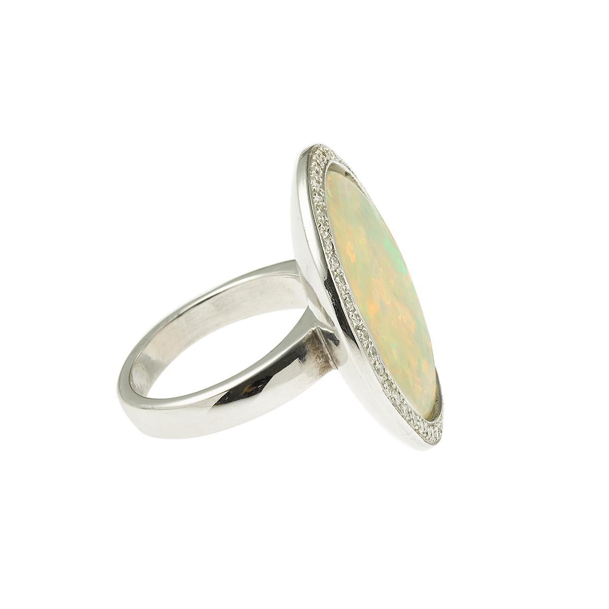 Elegant and rare round opal ring with diamonds on white gold. Unique piece.

Opal weight : 10.22 carats

Origin : Ethiopia

Total weight of the diamonds : 0.56 carats

Dimensions : 26 x 26 x 6.90 mm (1 x 1 x 0.27 inch)

Finger size : 52 (US :