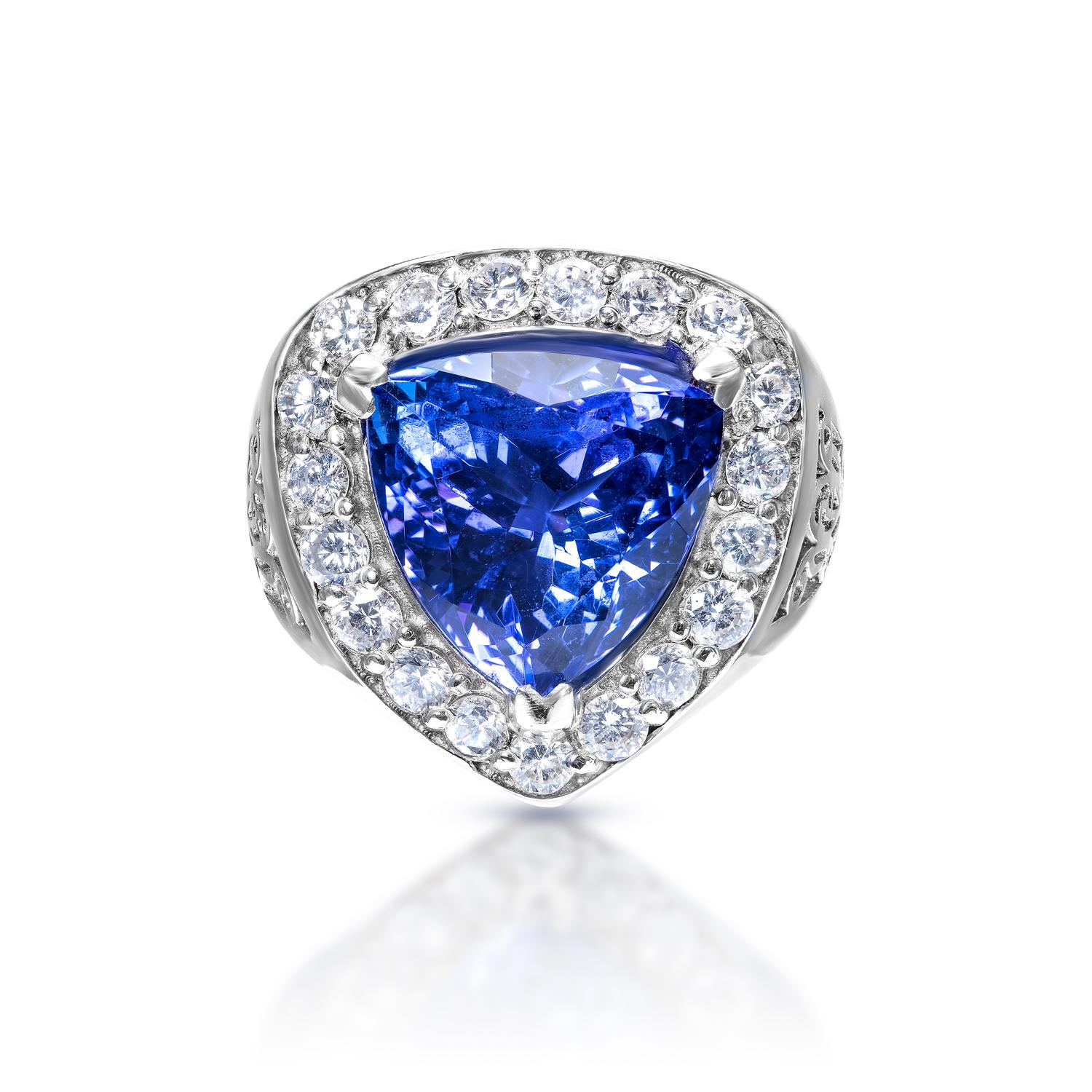 Center Stone Blue Tanzanite Ring:
Carat Weight: 9.06 Carats
Color: Blue Tanzanite
Clarity:  AAA
Style: Trilliant Cut


Diamond:
Carat Weight: 1.30 Carats
Shape: Round Brilliant Cut
Settings: Halo
Metal: 14 Karat White Gold


Total Carat Weight: