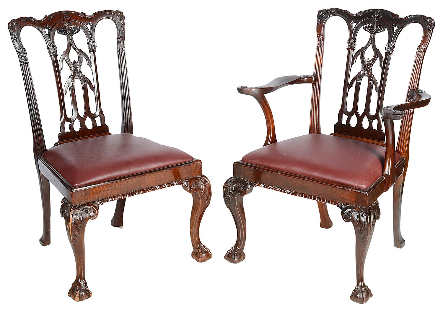 A good quality set of ten (2 arms, 8 single chairs) late 19th century mahogany Chippendale revival dining chairs. Each of the chairs having carved and pierced backrest in a Gothic style, burgundy leather upholstered drop in seats. Raised on carved