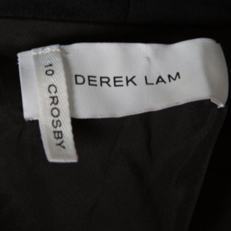 Se hai voglia di vestirti bene, questo blazer 10 Crosby Derek Lam è perfetto per te! La creazione nera è realizzata in crêpe e presenta una silhouette a strati. Presenta revers a scialle, finto gilet, chiusura frontale con bottoni e maniche lunghe.