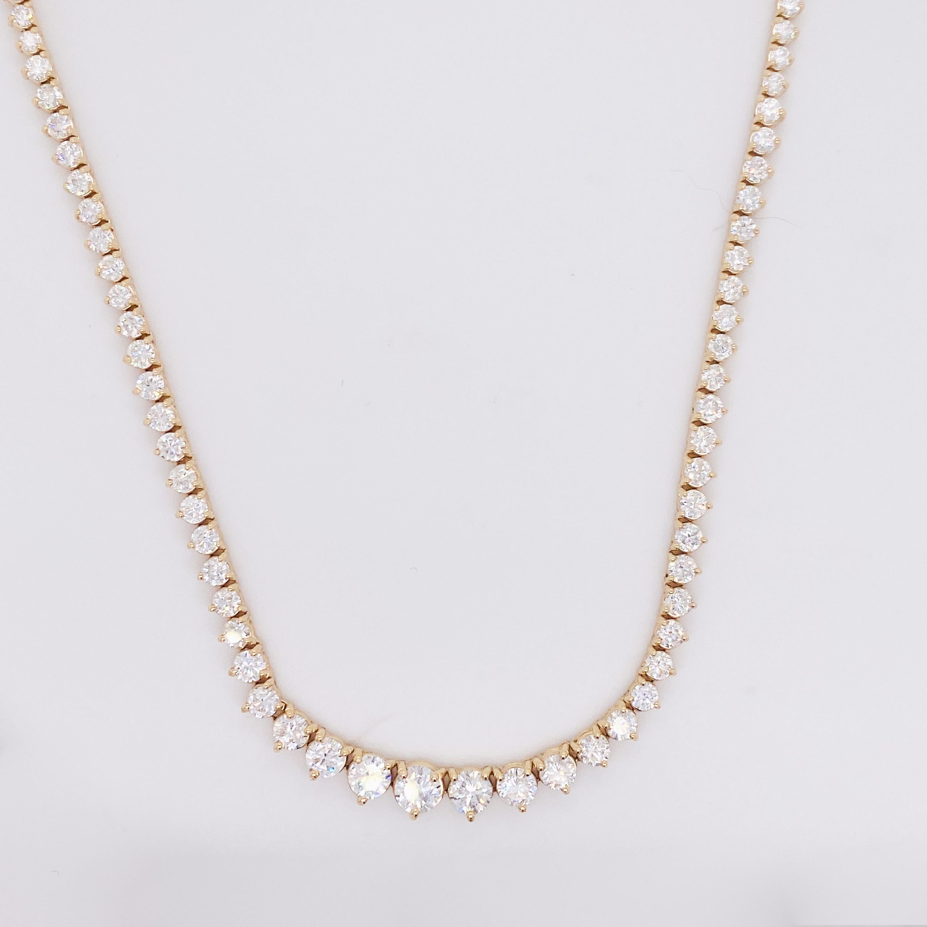 This beautiful Riviera graduated diamond tennis necklace adds grace and flair to your everyday look! The diamonds weigh a total of 10.00 carats and have SI clarity with G-H color. Each diamond is set with three prongs and sparkles brilliantly! The
