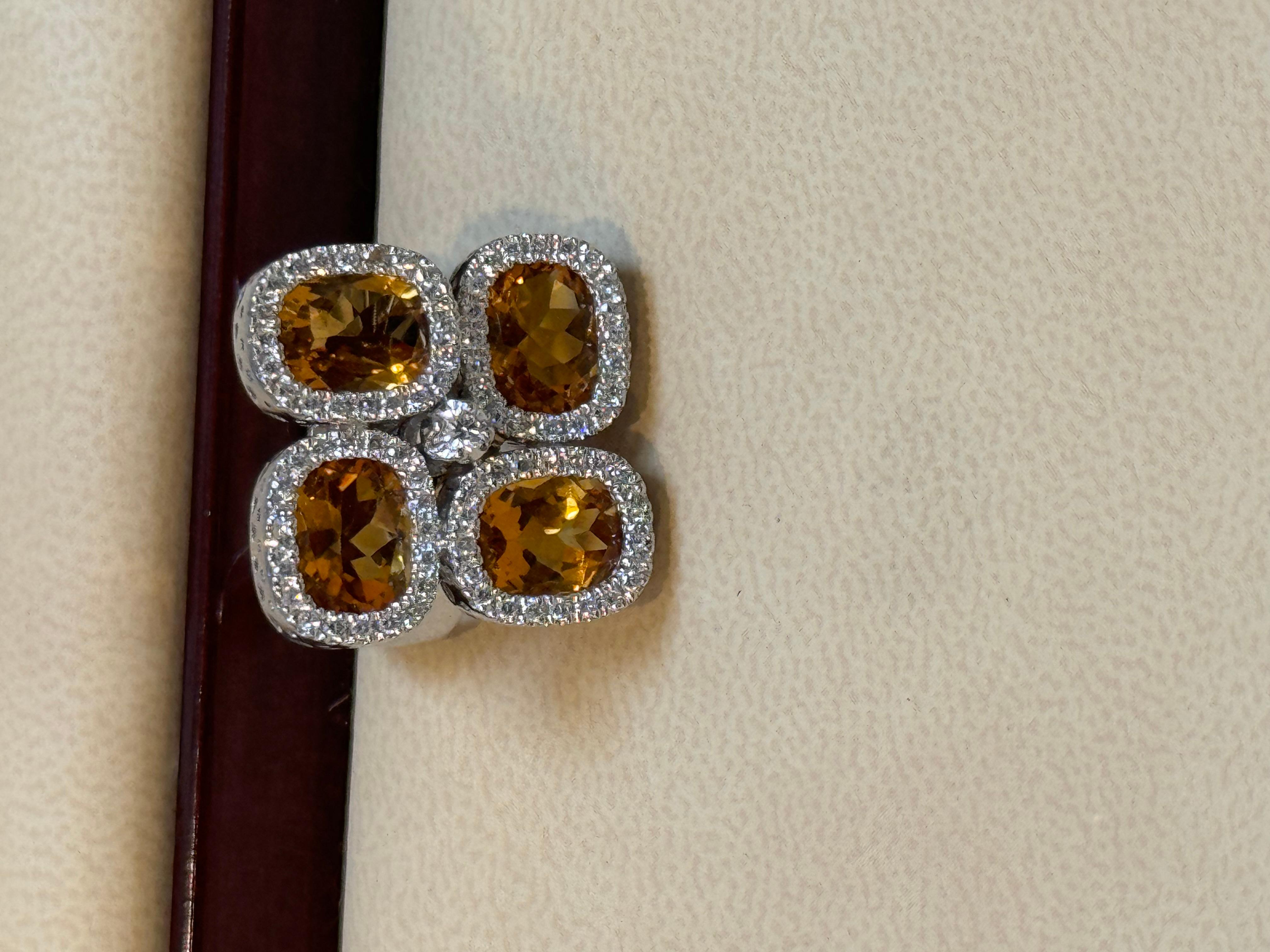 Approximately 10 Ct Natural Citrine & 1.5 CT Diamond Cocktail Ring 18 Karat White Gold, Estate
Beautiful statement piece with four pieces of citrine sitting in Geometric pattern , each one is surrounded by brilliant cut diamonds. 
This is a ring