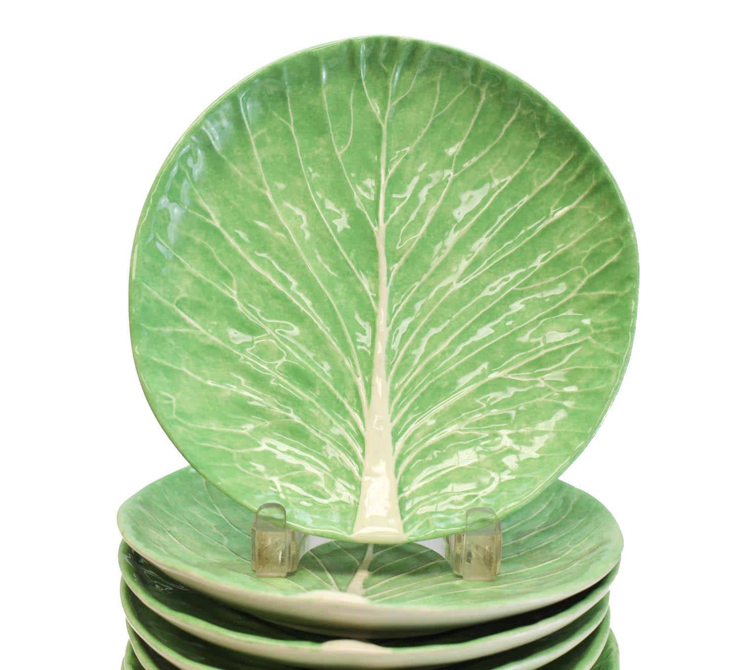 10 Dodie Thayer lettuce leaf ware salad plates in soft green. 8 plates marked Dodie Thayer, Jupiter. 2 plates with incised Dodie Thayer signature to underside.

Measures: 8 inch diameter.