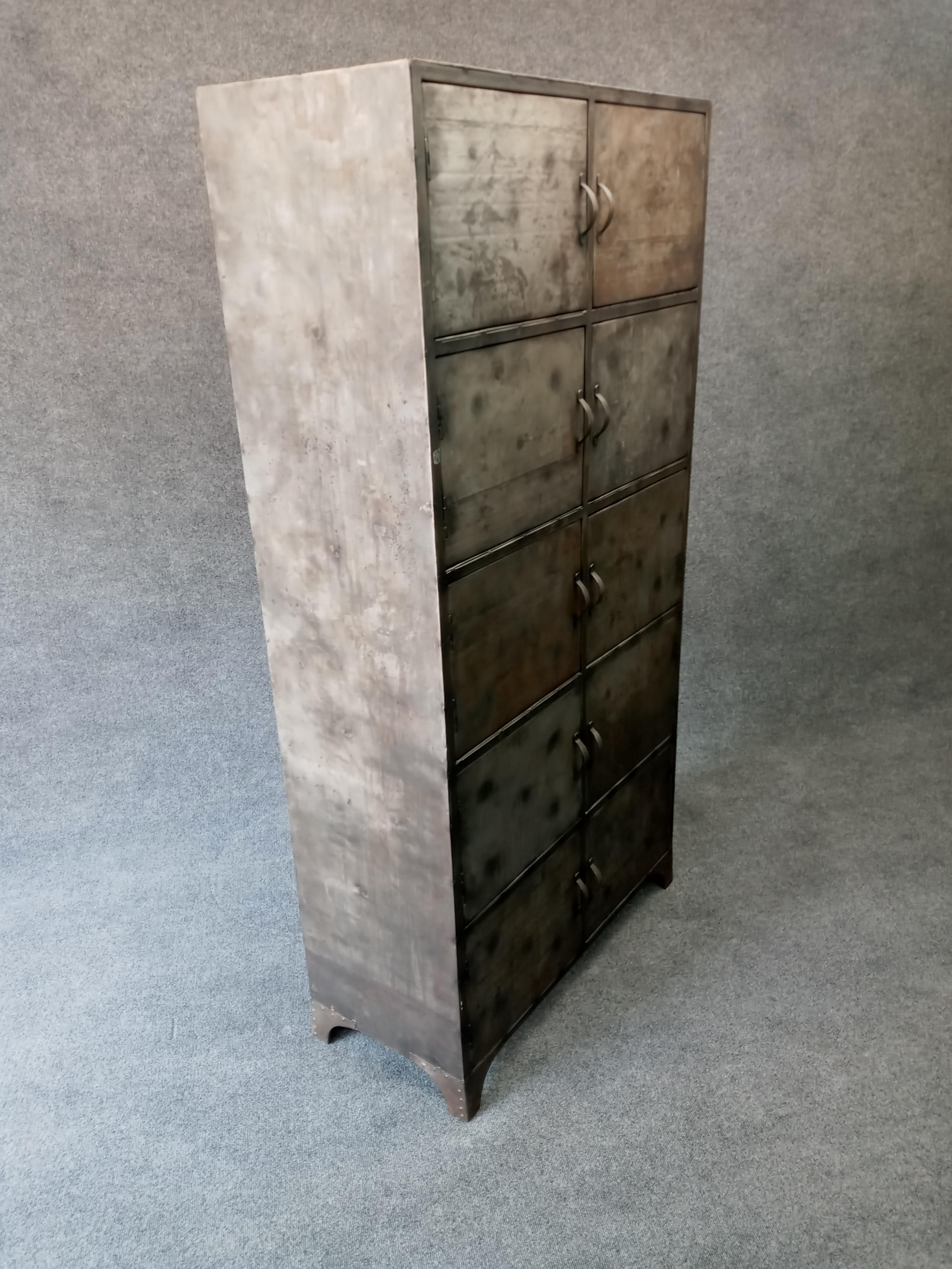 Large and practical, with open storage. Heavy and well made. Patinated metal cabinet. Can be used at home or in office.