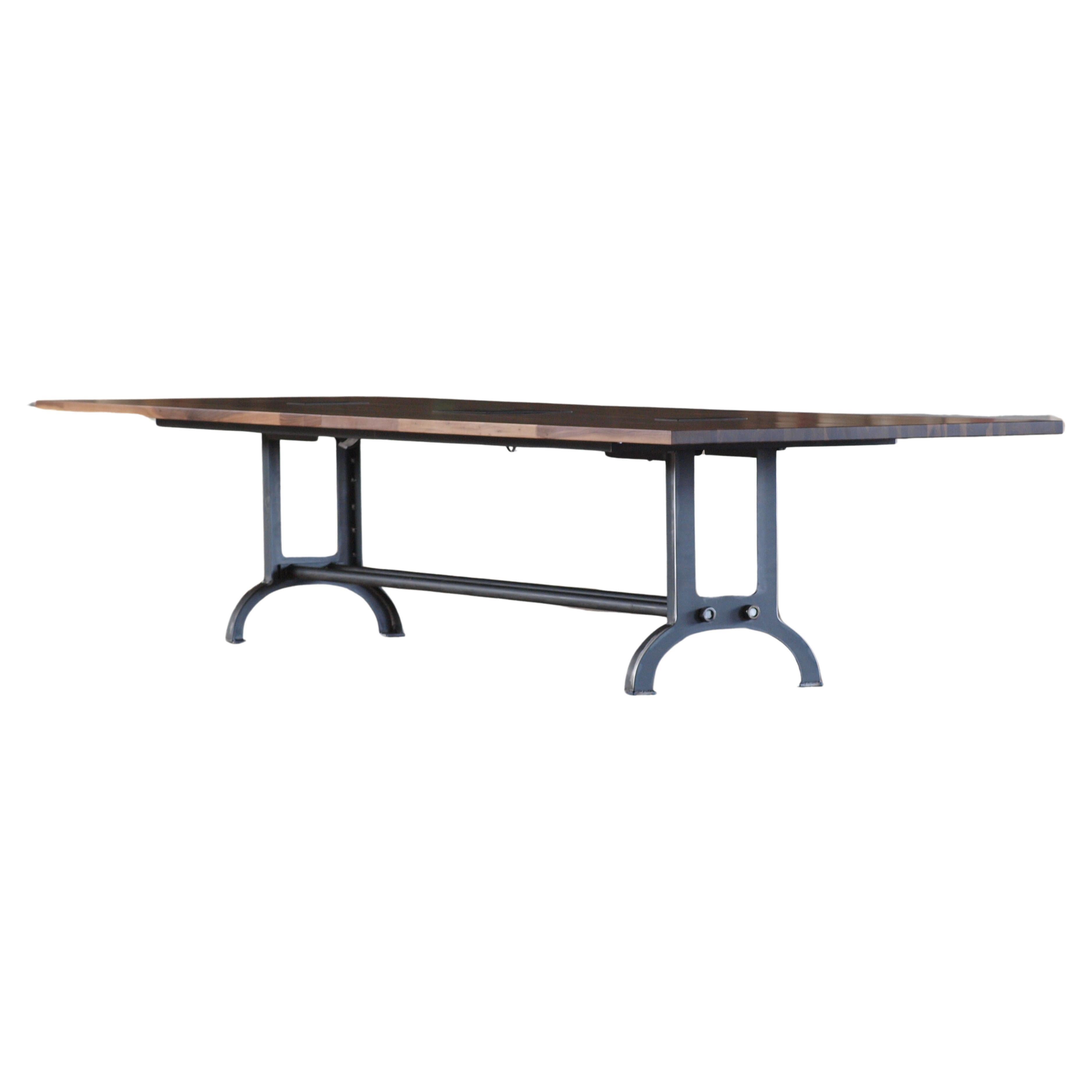 Introducing our exquisite, handcrafted industrial-style walnut conference table, a masterpiece that not only exudes elegance but also offers versatile functionality. While it is commonly employed as a commanding centerpiece for conference rooms, its