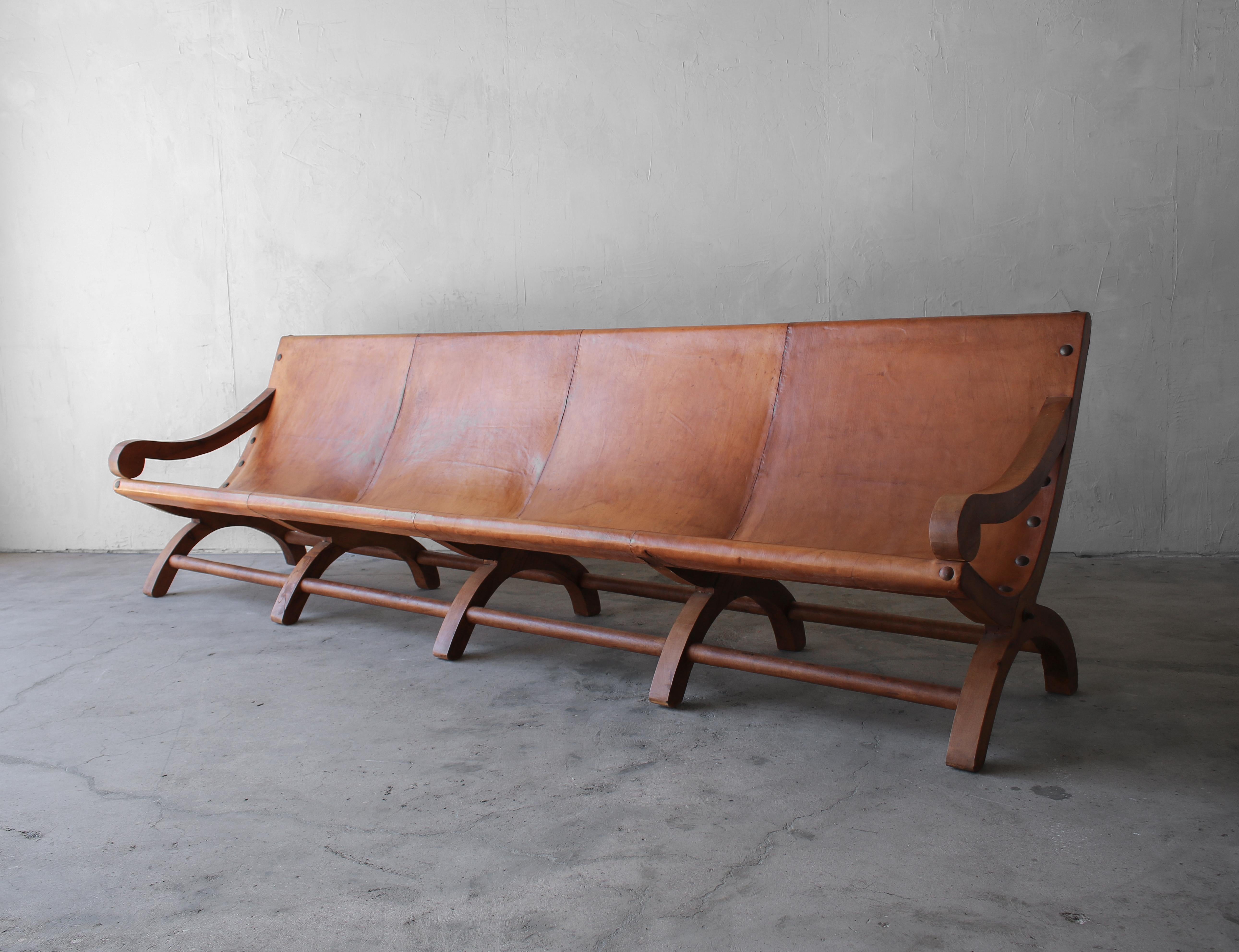 This vintage Butaque leather sling sofa is 10 feet of amazing. It was custom designed by the original owner made in Mexico in 1978.

Oversized and huge on character and style. This beauty is a sight to behold. With all the amazing details o