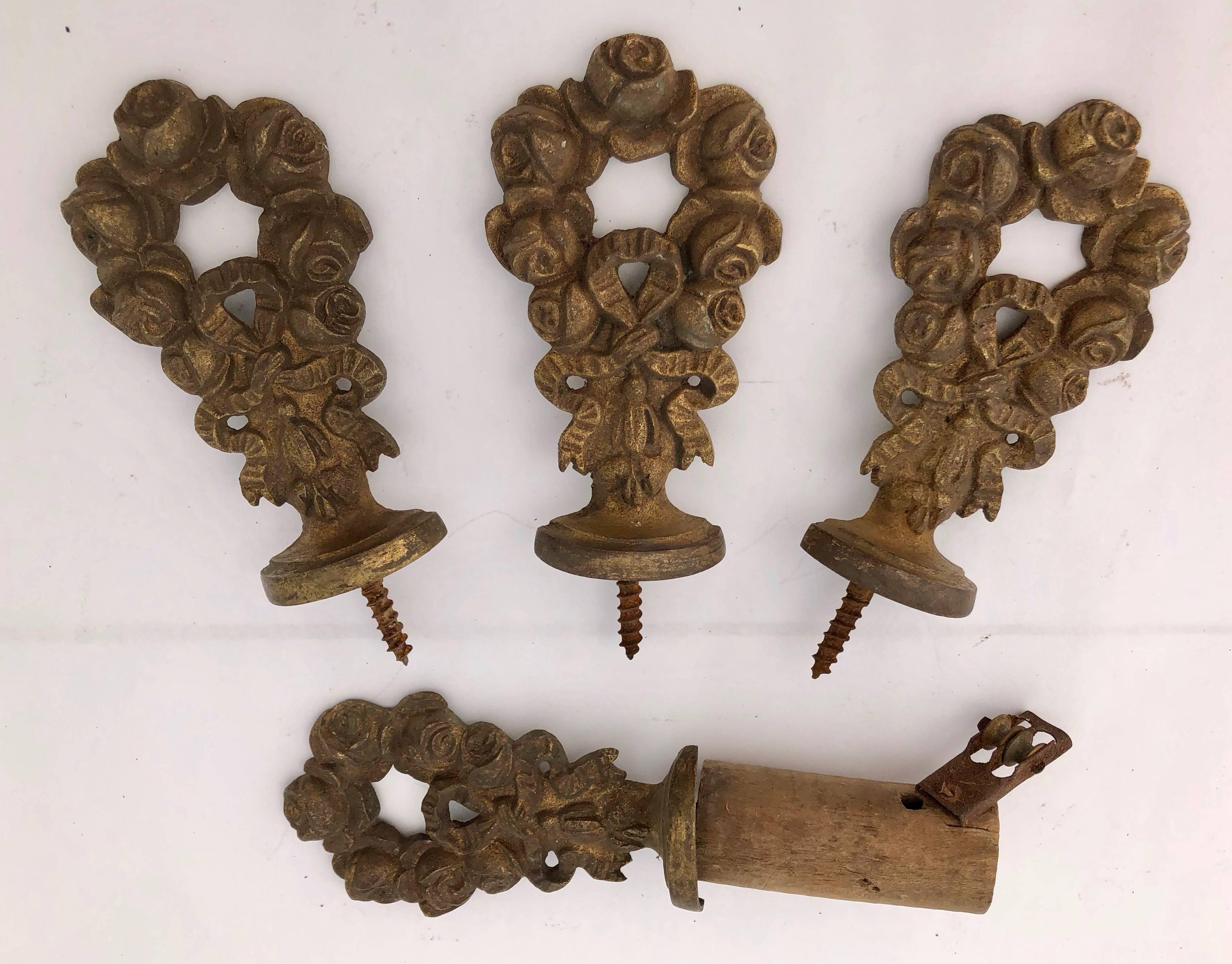 These are gorgeous brass curtain rod ends in a wonderful ose and laces. There are 10 in the set.

Sizes:
4 Rod ends size small W 2.4, D 0.25, H 4.3 inches
2 Rod ends size large W 2.75, D 0.75, H 4.25 inches
2 curtain tie backs W 2.3, D 4, H