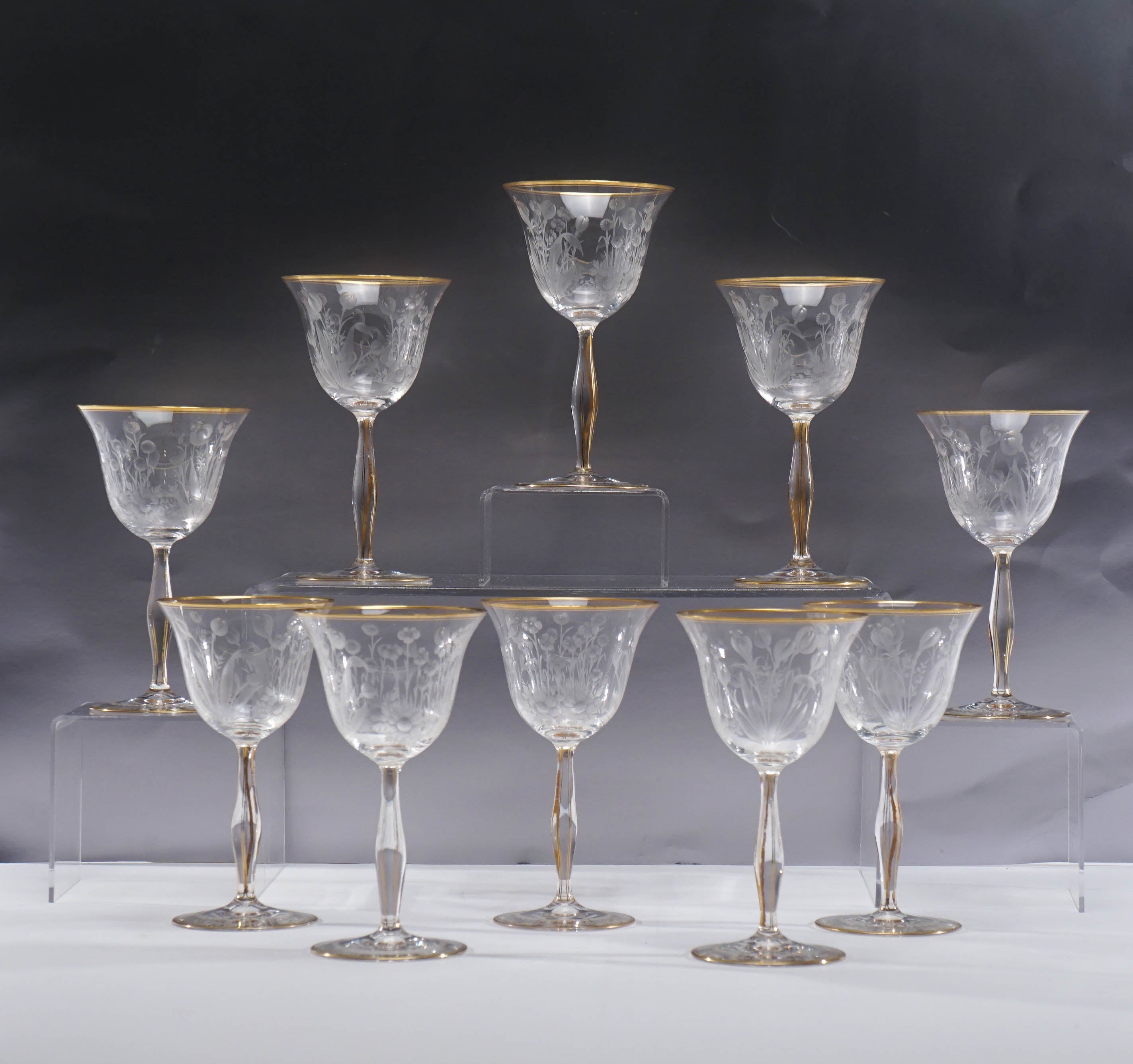 This set of 10 tall and elegant hand blown crystal wine goblets feature a masterfully wheel cut Art Nouveau floral motif. Standing 6 3/4