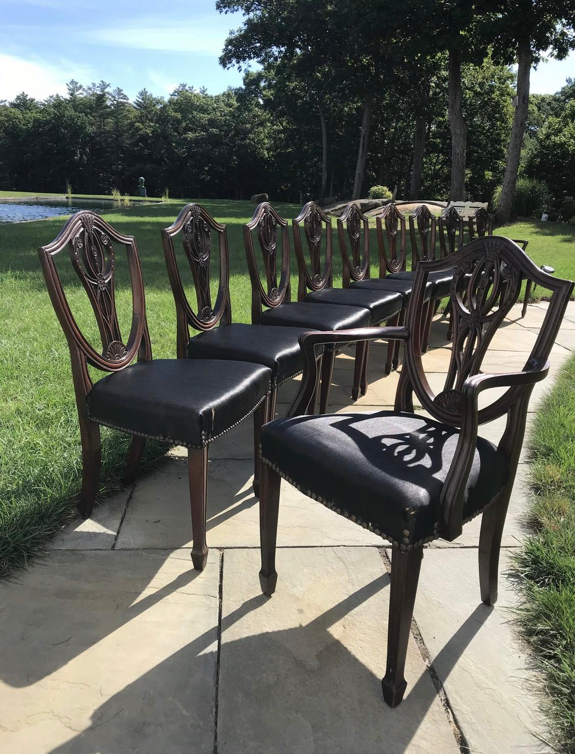 A rare set of 10 mahogany period Hepplewhite dining chairs. English ca 1810.
The shield back has carvings of wheat sheaves and bellflowers and rosettes the legs taper to a spade foot.