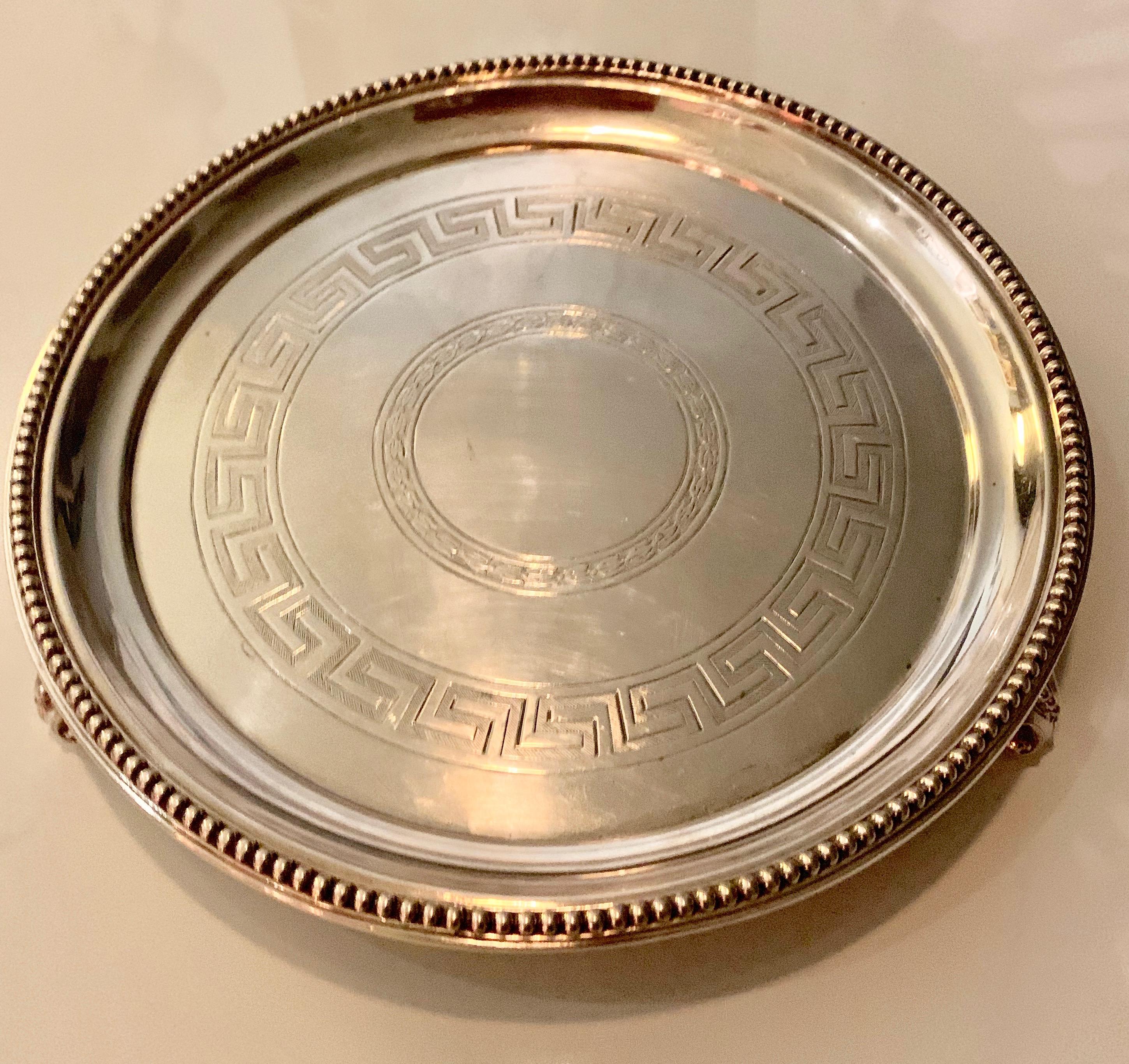 10 inch Silver Plate Greek Key Tray - a very handsome and significantly designed tray - this piece is the perfect compliment to your sophisticated bar... reminiscent of Georg Jensen, the feet are applied with small spheres in Silver. A great serving