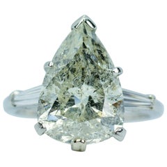 10% Irid 90% Platinum 6.65 Carat Pear Shape Diamond with Tapered Baguette Ring