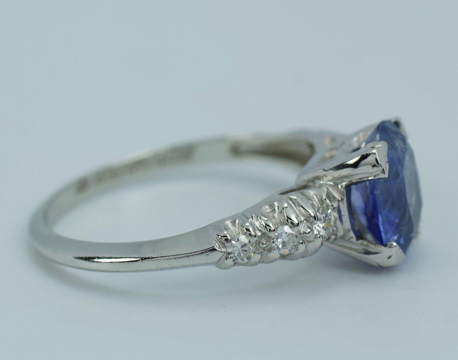 Oval Cut 10% Iridium 90% Platinum Oval Ceylon Blue Sapphire and Single Cut Diamond Ring