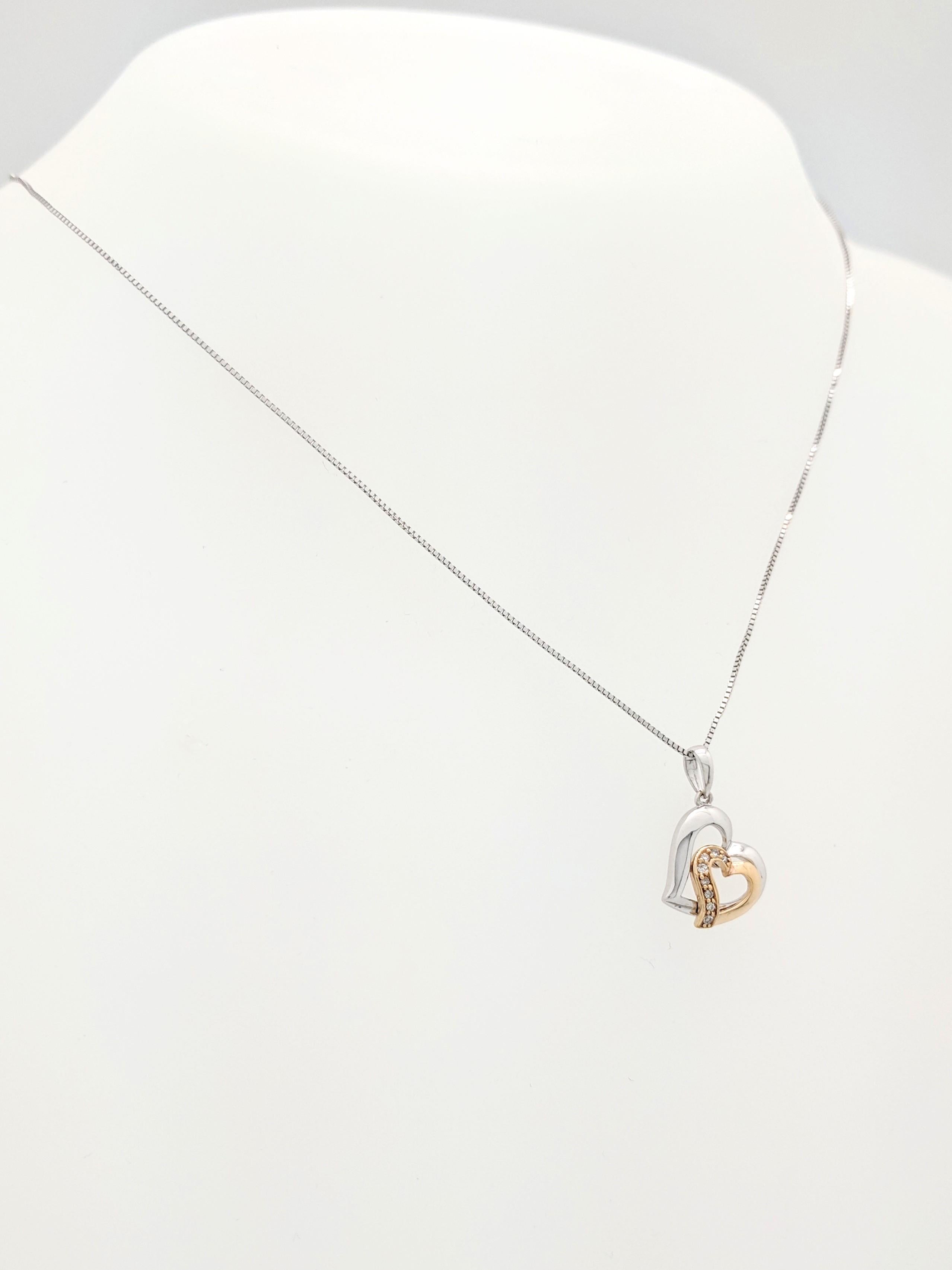 10K 2-Tone Diamond Heart Pendant Necklace

You are viewing a beautiful diamond heart pendant necklace. The piece is crafted from 10k white & yellow gold and weighs 1.8 gram. It features (8) .015ct round brilliant cut diamonds for an estimated