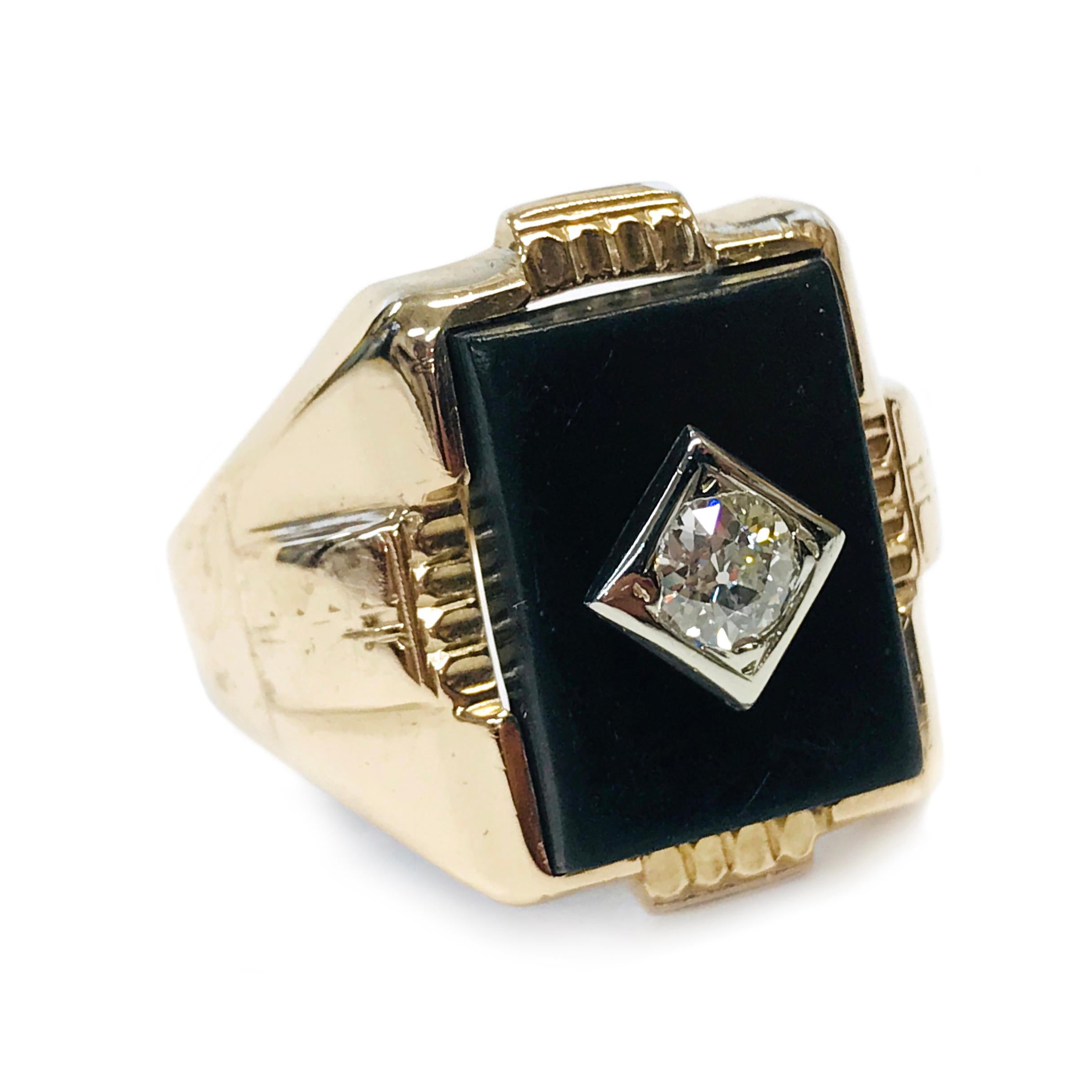 10 Karat Art Deco Diamond Onyx Ring. The band has Art Deco designs and all four sides and the band tapers. At the center of the ring is a 15.75mm x 11.8mm Onyx with a white gold square and a bezel-set round Euro-cut diamond. The 4.5mm diamond is VS2