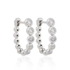 Boucles d'oreilles créoles huggies en or 10 carats et diamant