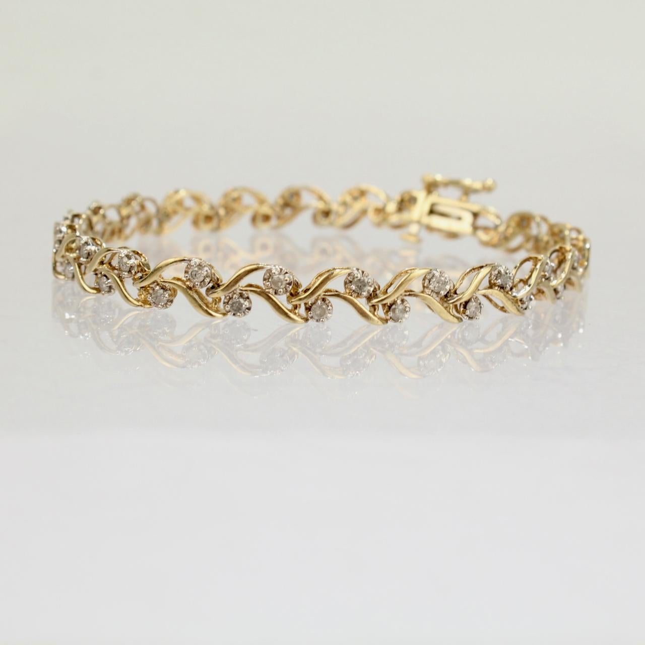 A very fine 10k gold and diamond tennis bracelet.

Date:
20th century

Overall Condition:
It is in overall good, as-pictured, used estate condition with some very fine and light surface scratches and other signs of expected light wear consistent