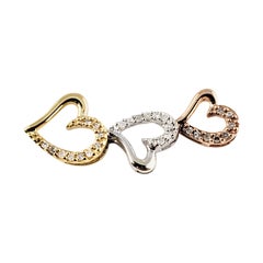 10 Karat Rose and Yellow Gold, Sterling Silver and Diamond Heart Pendant