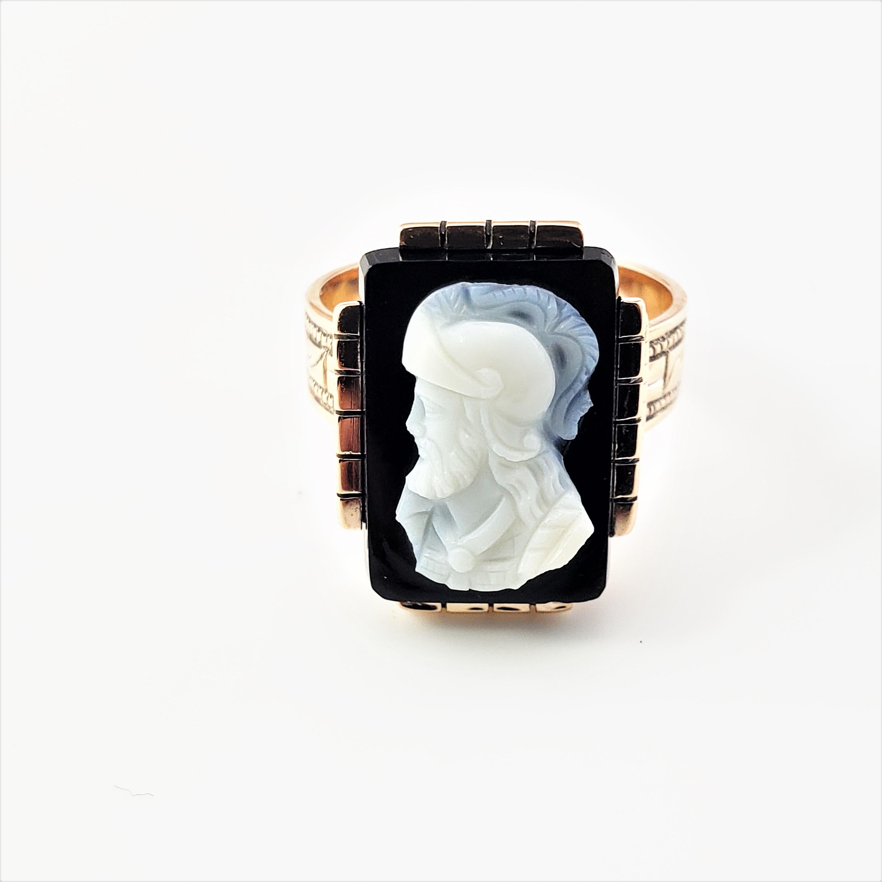 10 Karat Rose Gold and Onyx Cameo Ring Size 6-

This stunning onyx cameo ring is set in beautifully detailed 10K rose gold.  Top of ring measures 
18 mm x 13 mm.  Shank:  5 mm.  Inner monogram reads 