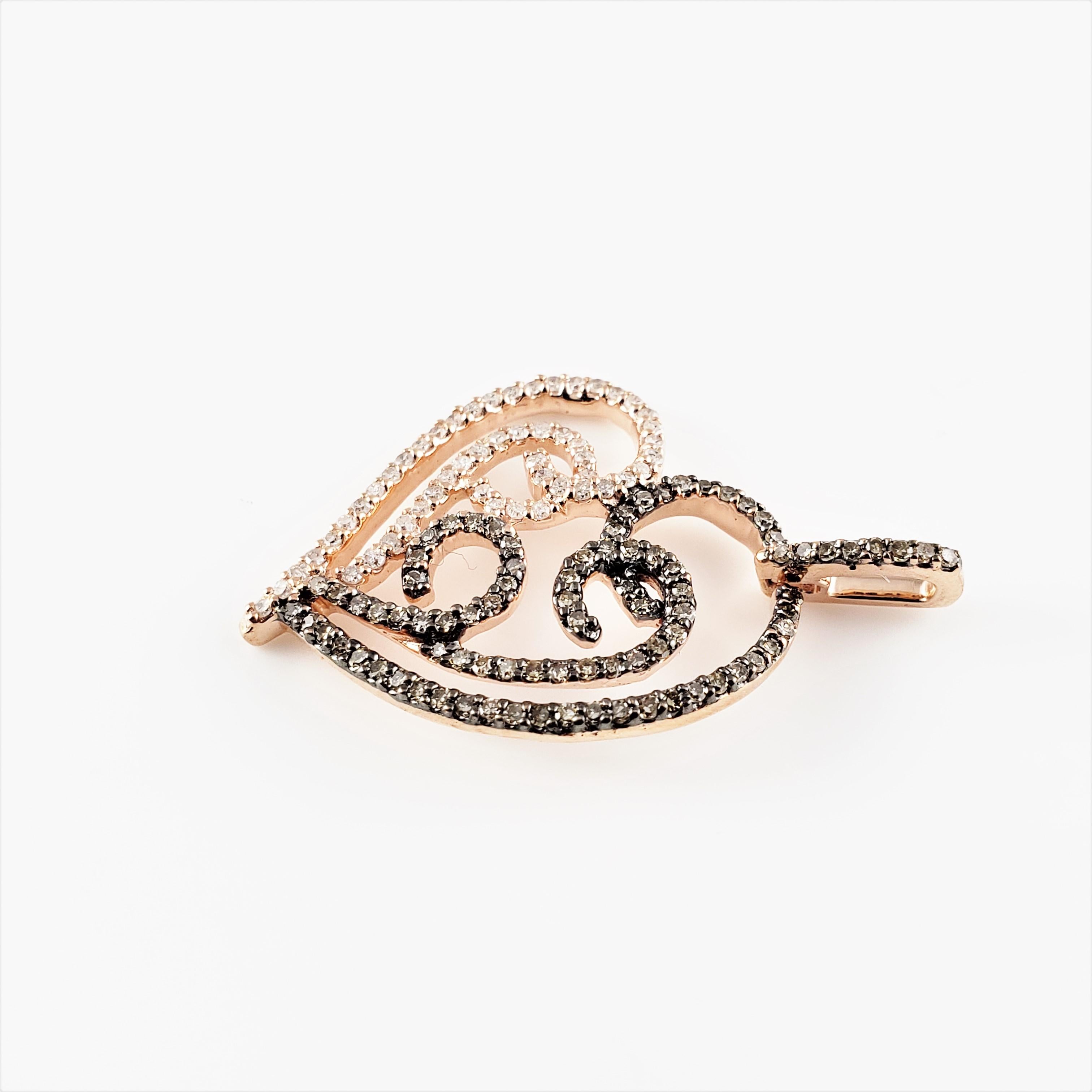 Vintage 10 Karat Rose Gold Champagne and White Diamond Heart Pendant-

This lovely heart pendant features 54 white round single cut diamonds and 82 champagne round single cut diamonds set in 10K rose gold.

Approximate total diamond weight: .68
