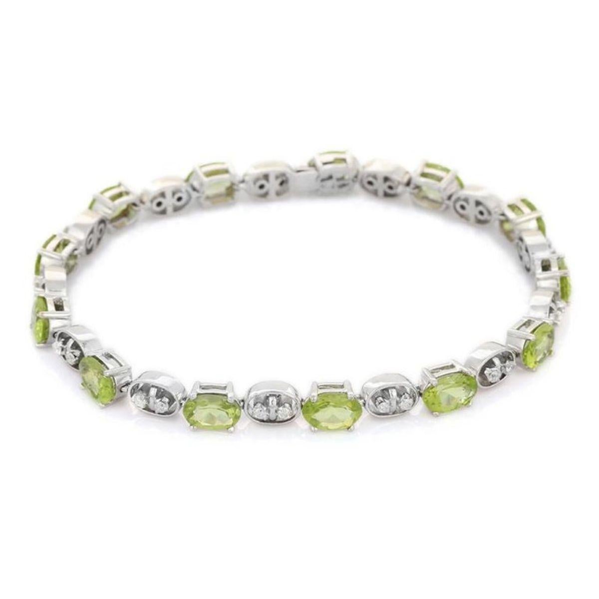 This Peridot Diamond Tennis Bracelet in 10K gold showcases 13 endlessly sparkling natural peridot, weighing 9.15 carats and 26 diamonds weighing 0.38 carats. It measures 7.25 inches long in length. 
Peridot attracts love and calms anger by giving