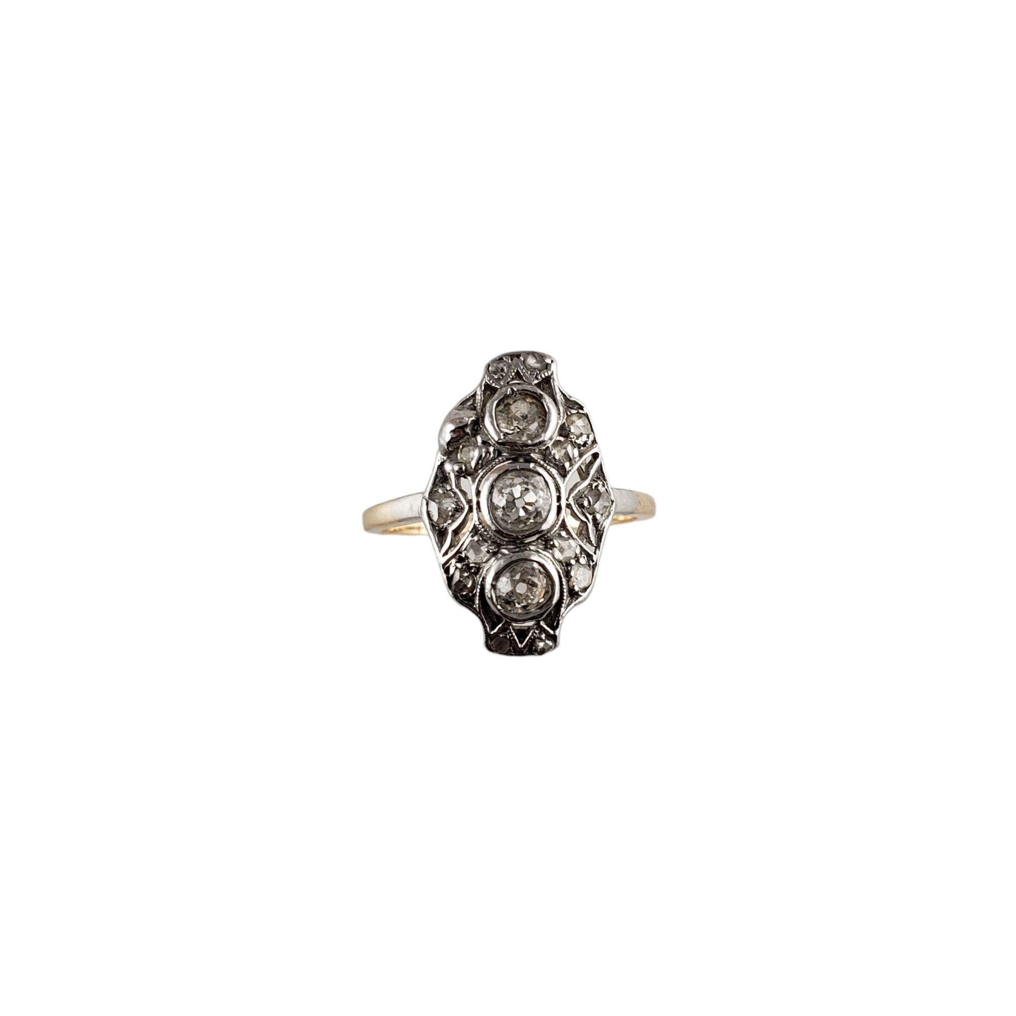 Vintage 10 Karat Two-Tone Gold and Diamond Ring-

This lovely ring features three round European cut diamonds and 13 rose cut diamonds set in beautifully detailed 10K white and yellow gold. Top of ring measures 17 mm x 11 mm. Shank: 1