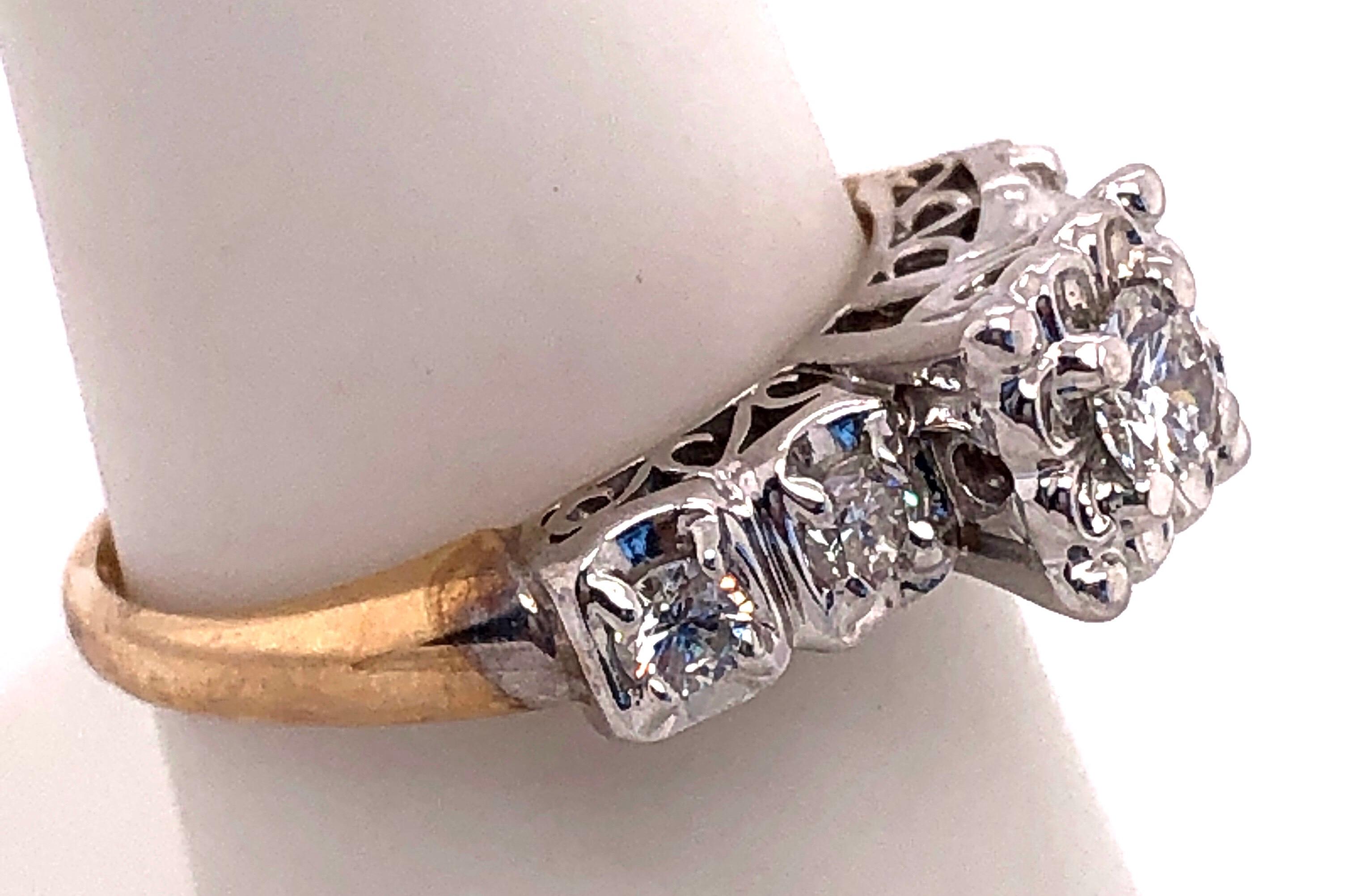 Anello di fidanzamento con diamante in oro 10 carati bicolore 0,60 TDW.
Dimensione 7.25
3,44 grammi di peso totale.