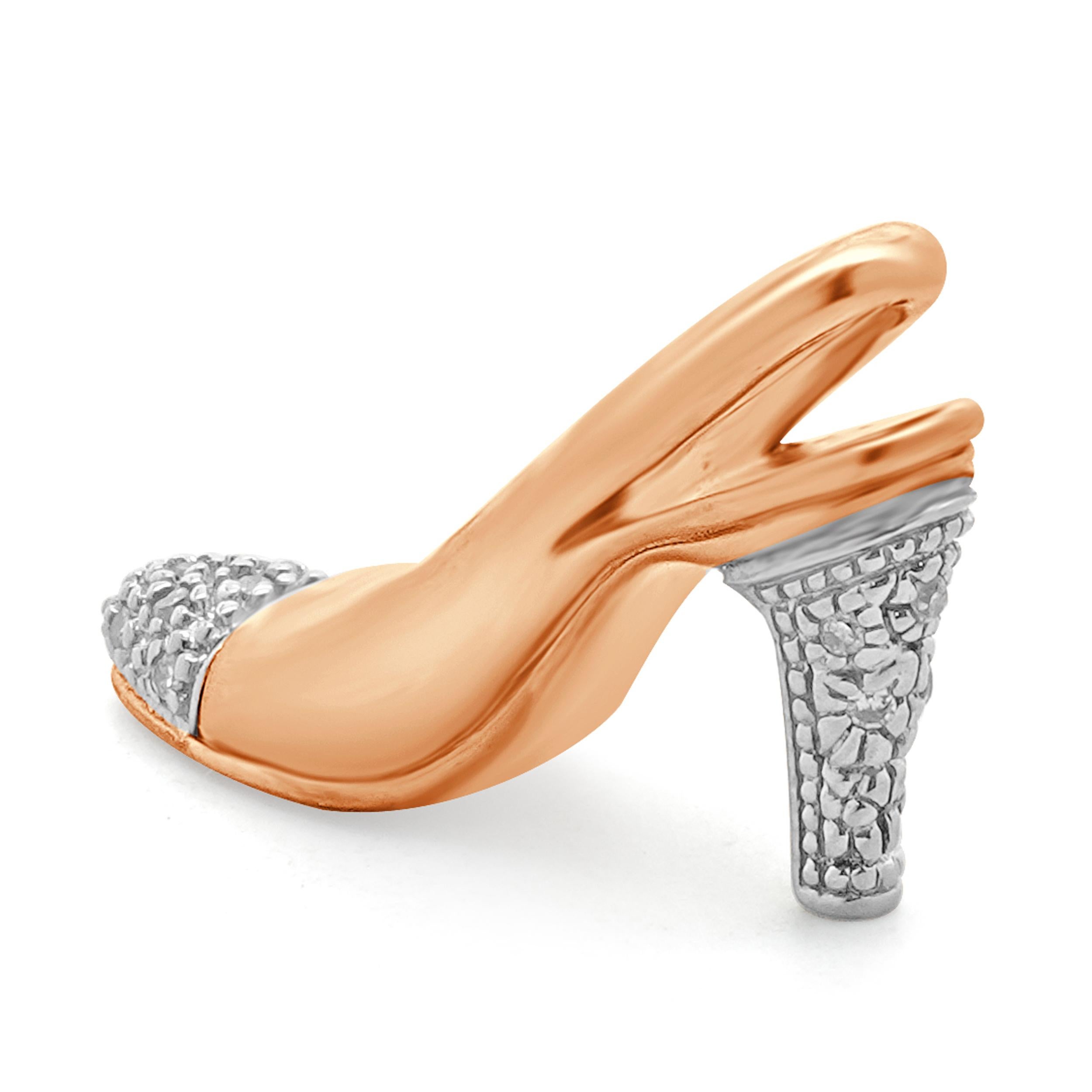 Designer: custom
Material: 10 rose and white gold
Diamonds: 14 round cut = 0.14ct
Color: I
Clarity: SI2
Dimensions: pendant measures approximately 27mm x 6.9mm
Weight: 1.75 grams
