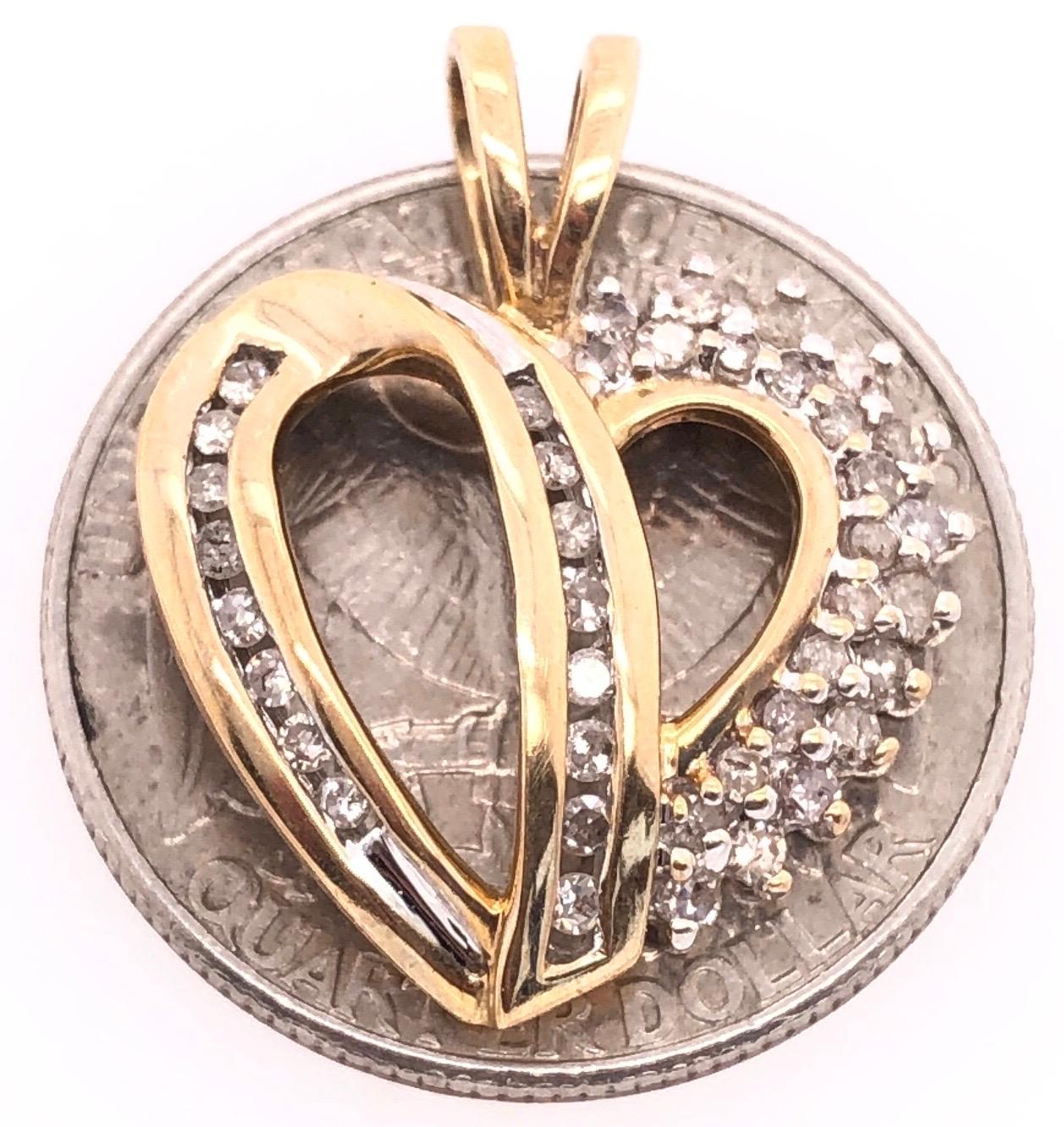 10 Karat Two Tone Heart Pendant with Diamonds 0.40 TDW.
3.14 grams total weight.