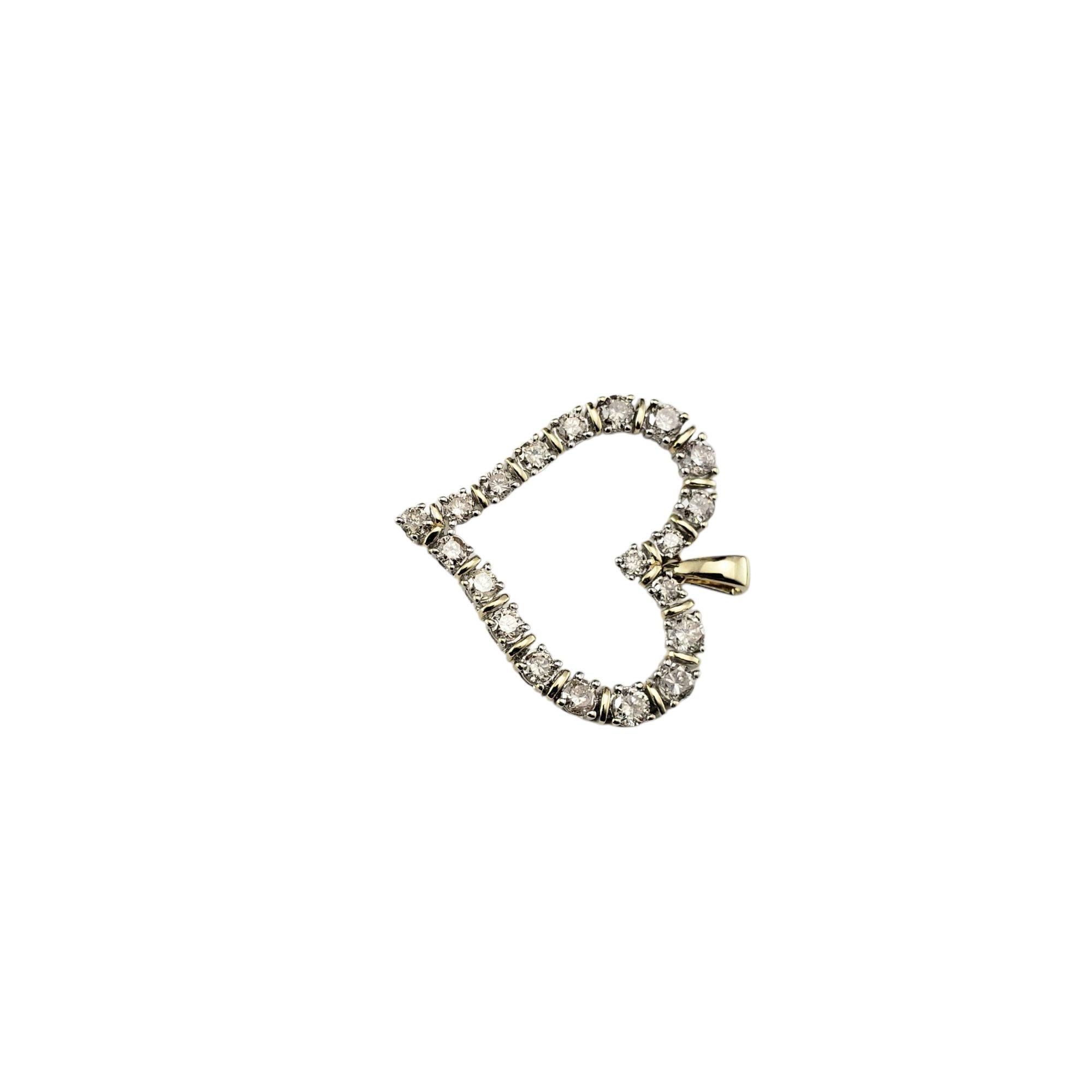 10 Karat White and Yellow Gold Diamond Heart Pendant-

This elegant open heart pendant is crafted in 10K white and yellow gold and features 20 round brilliant cut diamonds.

Approximate total diamond weight: .80 ct - .90 ct.

Diamond color: