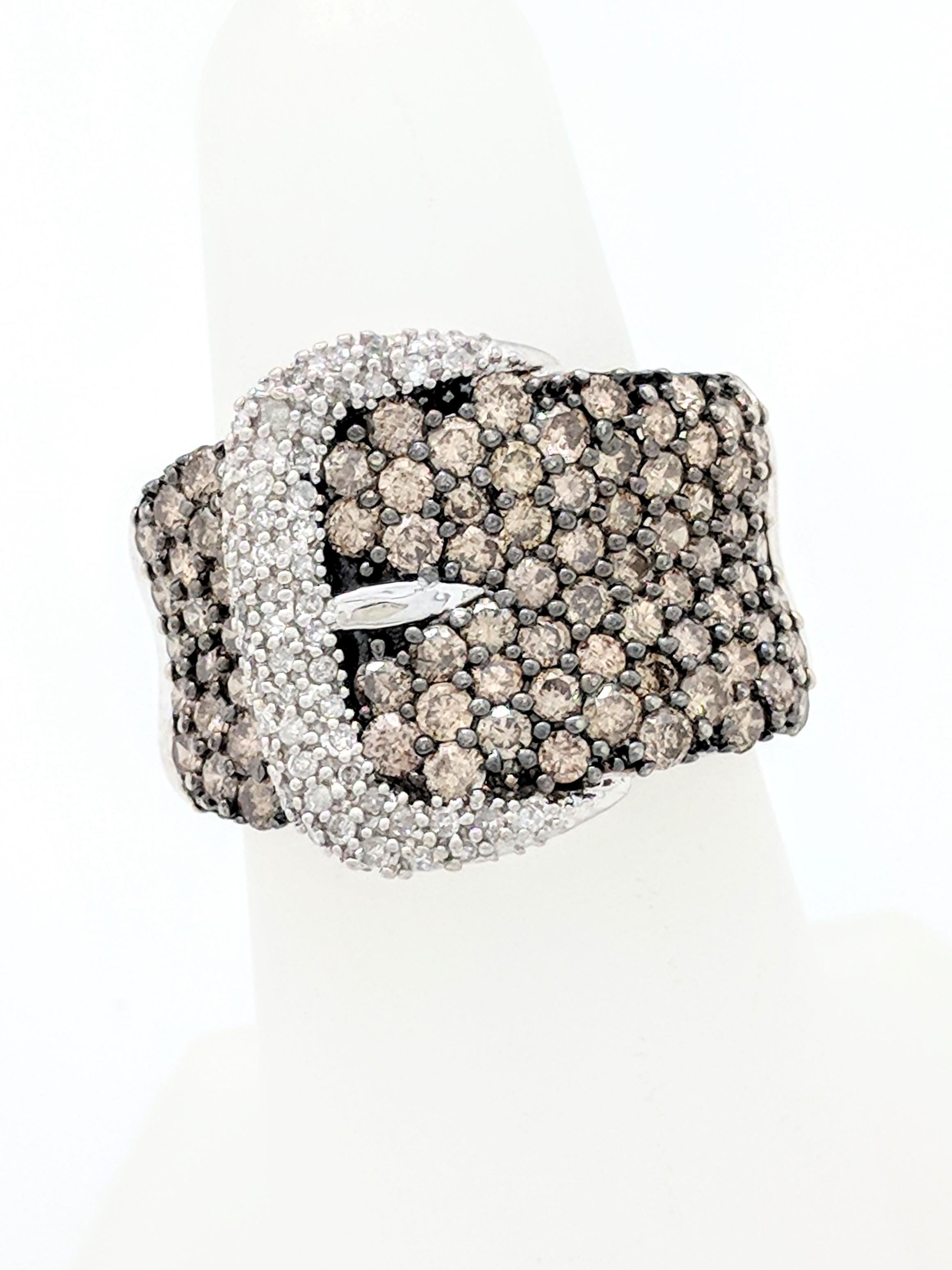 10K White Gold 1.45ctw White & Champagne Pave Diamond Buckle Ring Size 6.5

You are viewing a beautiful pave diamond right hand ring. This ring is crafted from 10k white gold and weighs 6.4 grams. The top of the ring measures 17mm in width and the