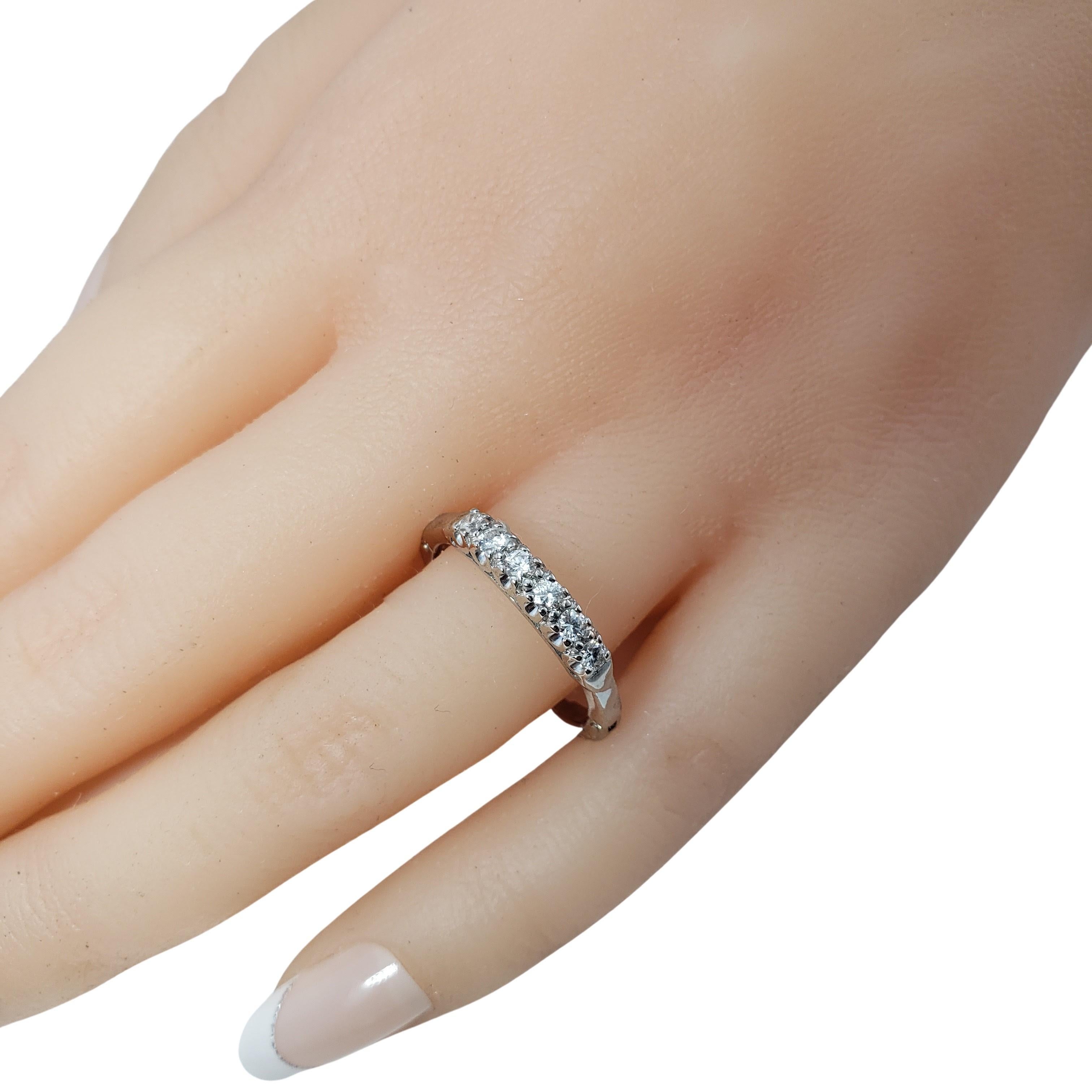 Vintage 10 Karat White Gold Adjustable Comfort Fit Diamond Wedding Band Ring Size 6.25-7-

This sparkling adjustable comfort fit band features six round brilliant cut diamonds set in classic 10K white gold.
Width: 3 mm. Shank: 2 mm.

Approximate
