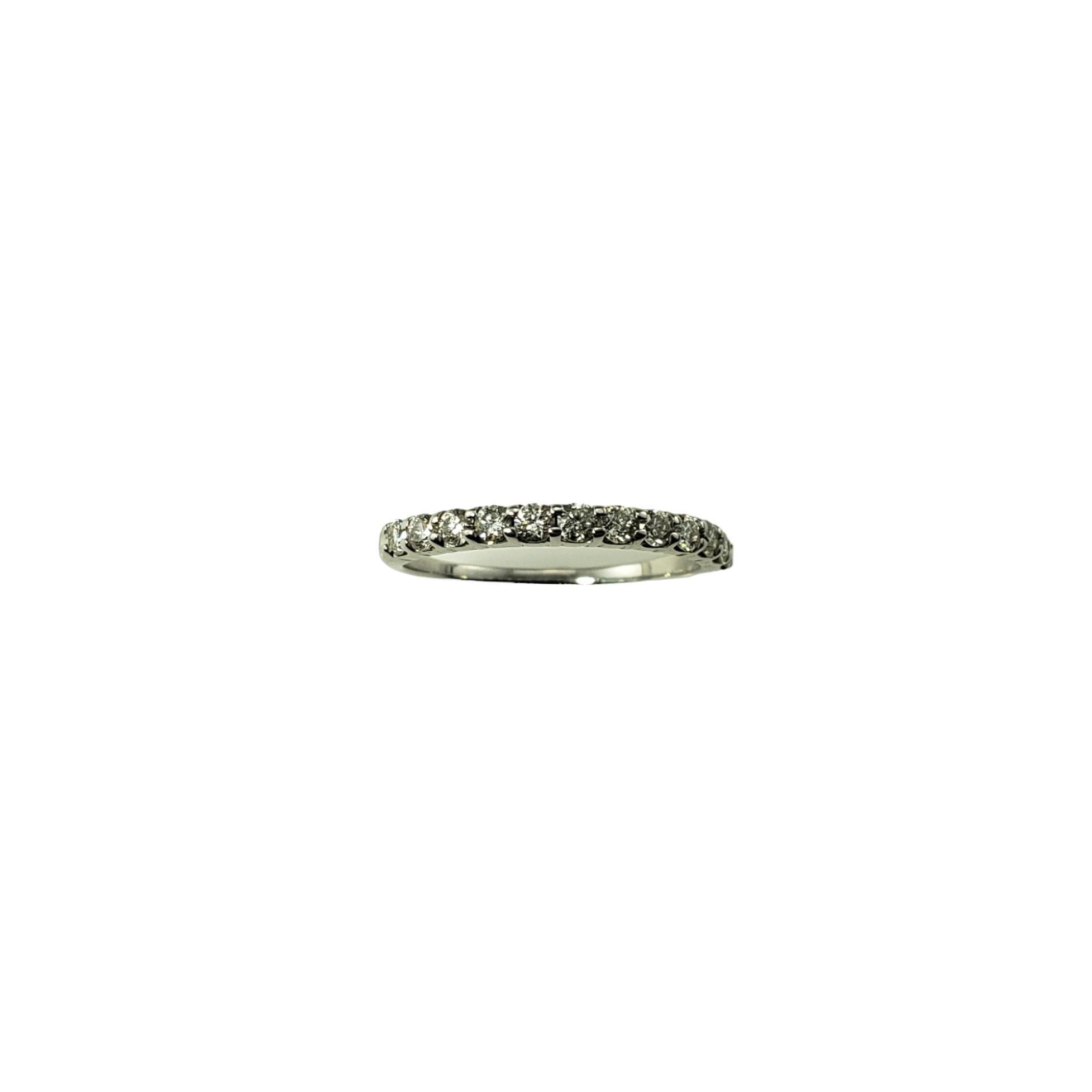 Vintage 10K White Gold and Diamond Band Ring Size 7.25-

This sparkling band features 12 round brilliant cut diamond set in classic 10K white gold.  Width: 2 mm.  Shank: 1.3 mm.

Approximate total diamond weight: .36 ct. 

Diamond clarity: 