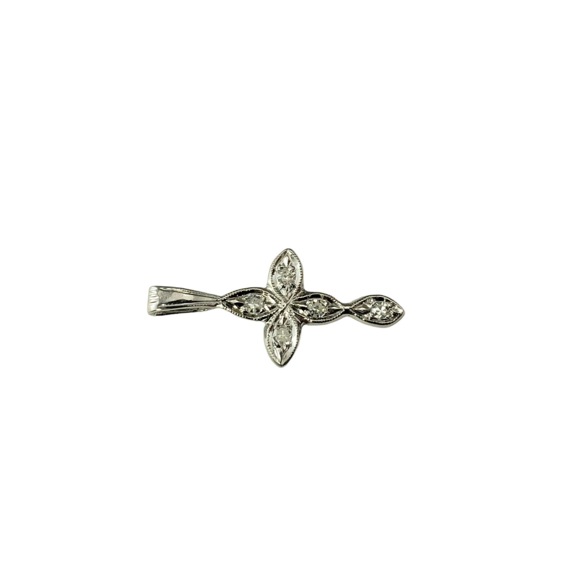 10 Karat White Gold and Diamond Cross Pendant-

This lovely cross pendant features five round single cut diamond set in classic 10K white gold.

Approximate total diamond weight: .05 ct.

Diamond color: I

Diamond clarity: SI1-I1

Size: 20 mm x 9