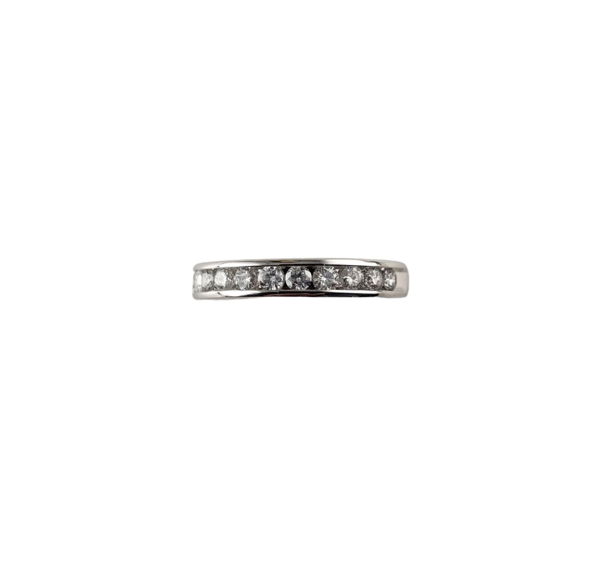 Vintage 10 Karat White Gold and Diamond Wedding Band Ring Size -

This sparkling band features 12 round brilliant cut diamonds set in classic 10K white gold. Width: 3 mm.

Approximate total diamond weight:  .60 ct.

Diamond color:  I

Diamond