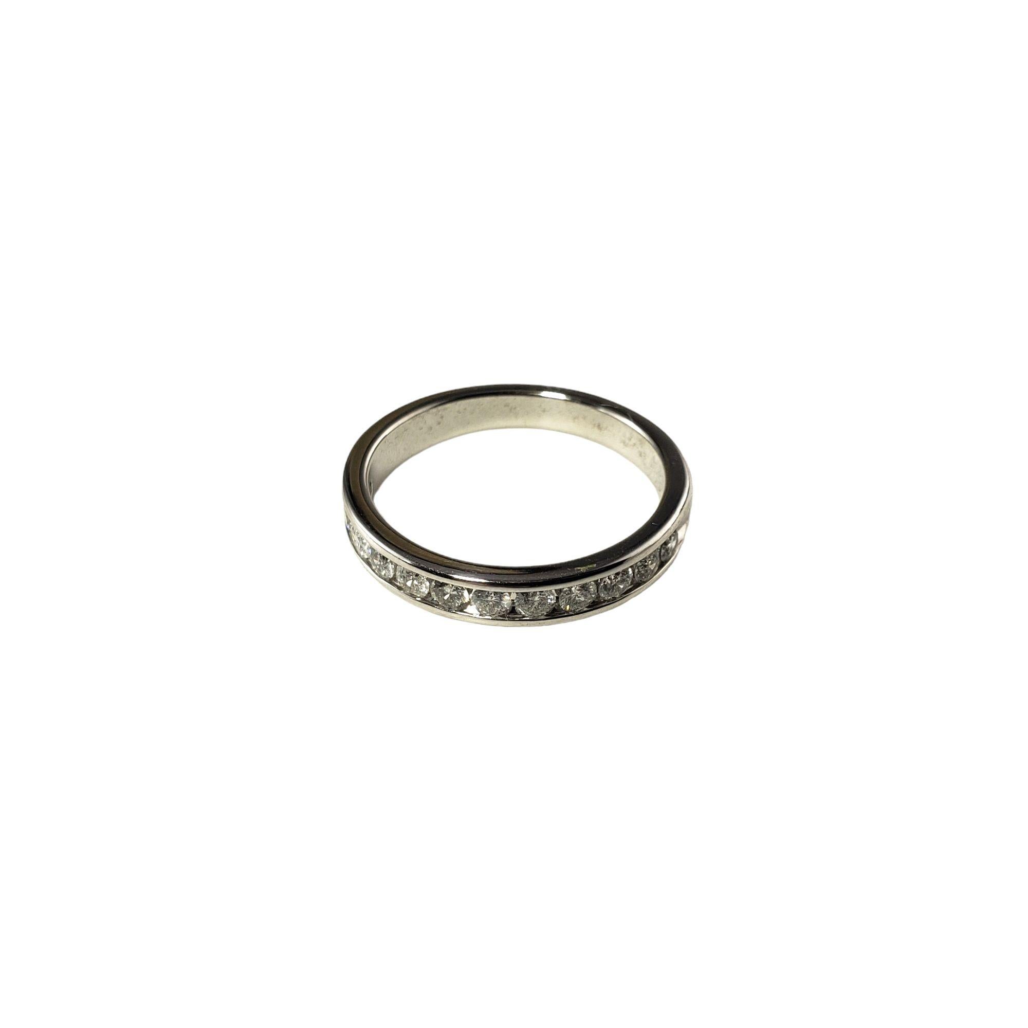 Vintage 10 Karat White Gold and Diamond Wedding Band Ring Size -

This sparkling band features 12 round brilliant cut diamonds set in classic 10K white gold. Width: 3 mm.

Approximate total diamond weight: .60 ct.

Diamond color: I

Diamond clarity: