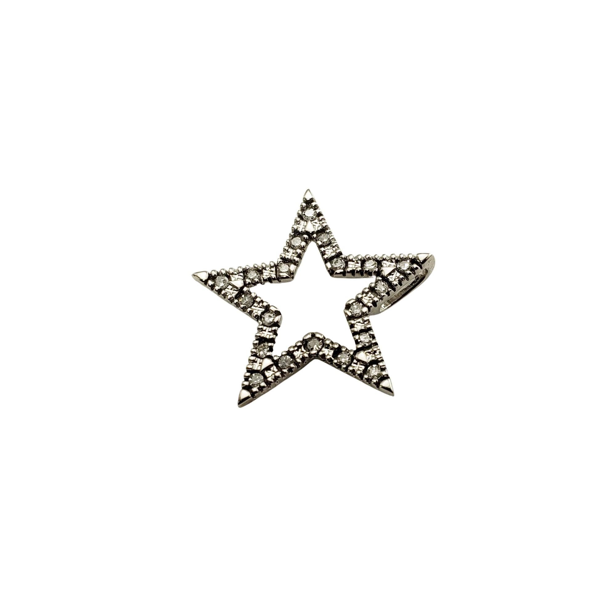 Vintage 10 Karat White Gold Diamond Star Pendant-

This sparkling star pendant features 20 round single cut diamonds set in classic 10K white gold.

*Chain not included.

Approximate total diamond weight:  .10 ct.

Diamond color: J-K

Diamond
