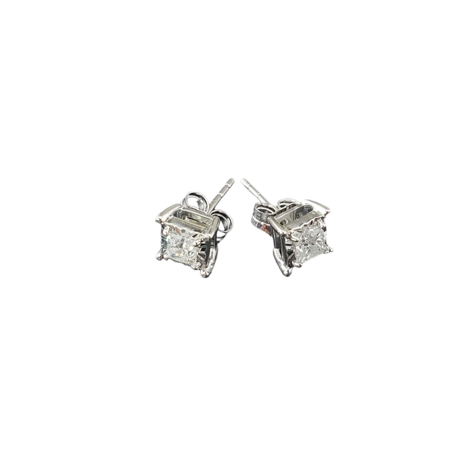 10 Karat White Gold and Diamond Stud Earrings-

These sparkling stud earrings each feature one princess cut diamond set in classic 14K white gold.  Push back closures.

Approximate total diamond weight:  .50 ct.

Diamond color: I

Diamond clarity: