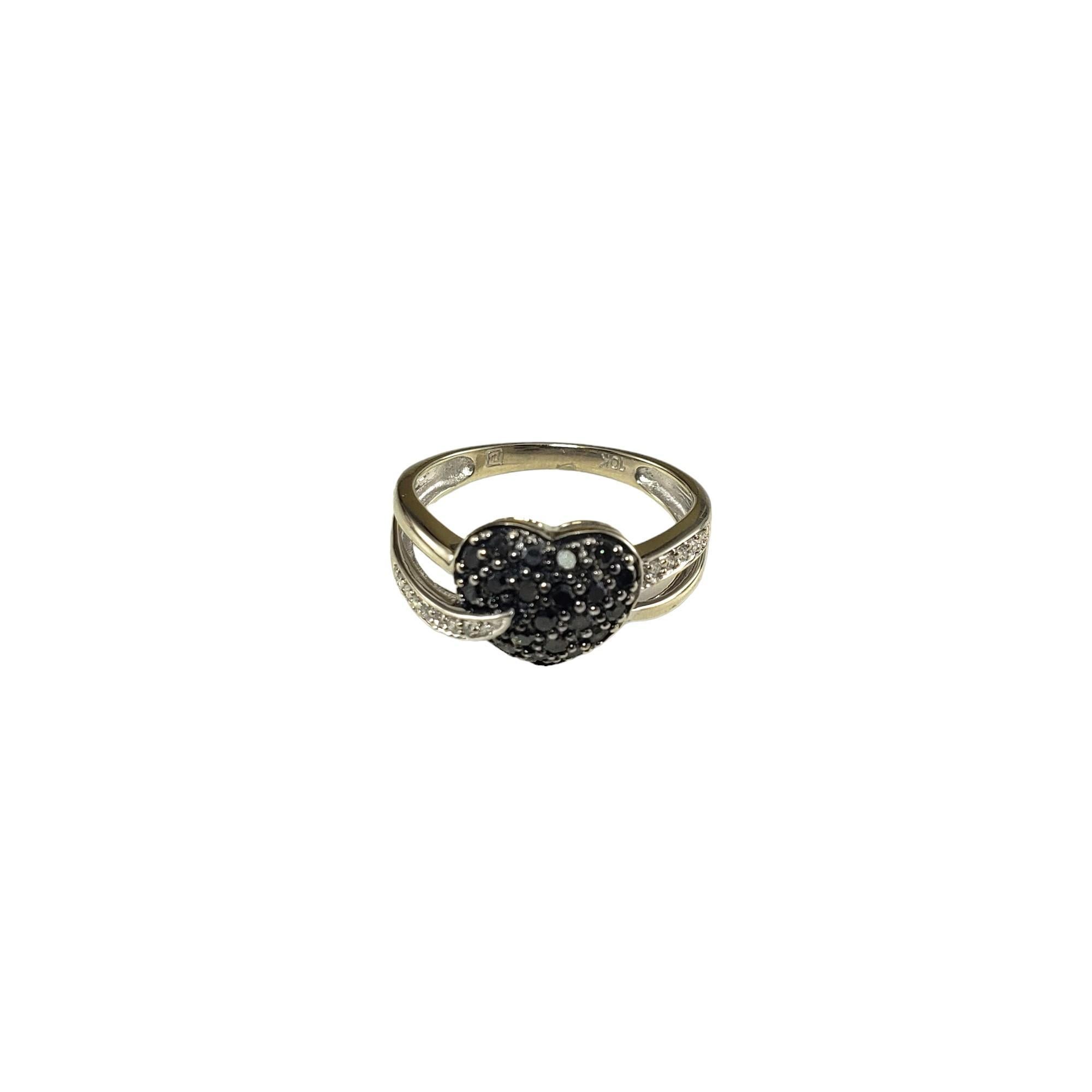 Vintage 10K White Gold Black Stone and White Diamond Heart Ring Size 6.25-

This lovely heart ring features 20 black stones and 12 round single cut white diamonds set in beautifully detailed 10K white gold. Width: 10 mm.  Shank: 2 mm.

Approximate