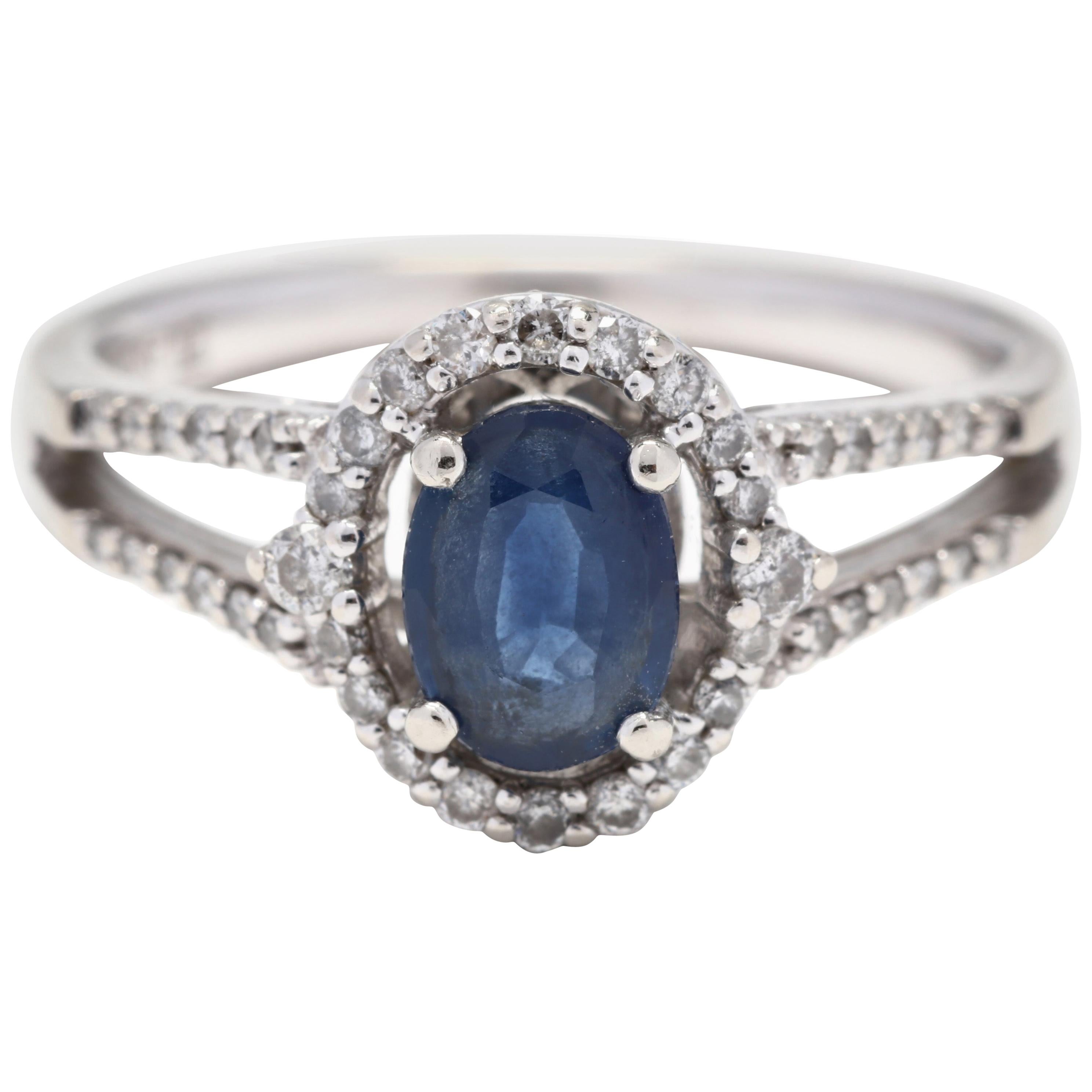10 Karat White Gold, Blue Stone and Diamond Halo Ring