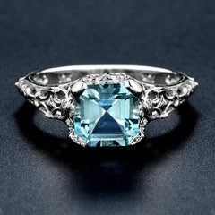 10 Karat White Gold Blue Topaz Filigree Ring