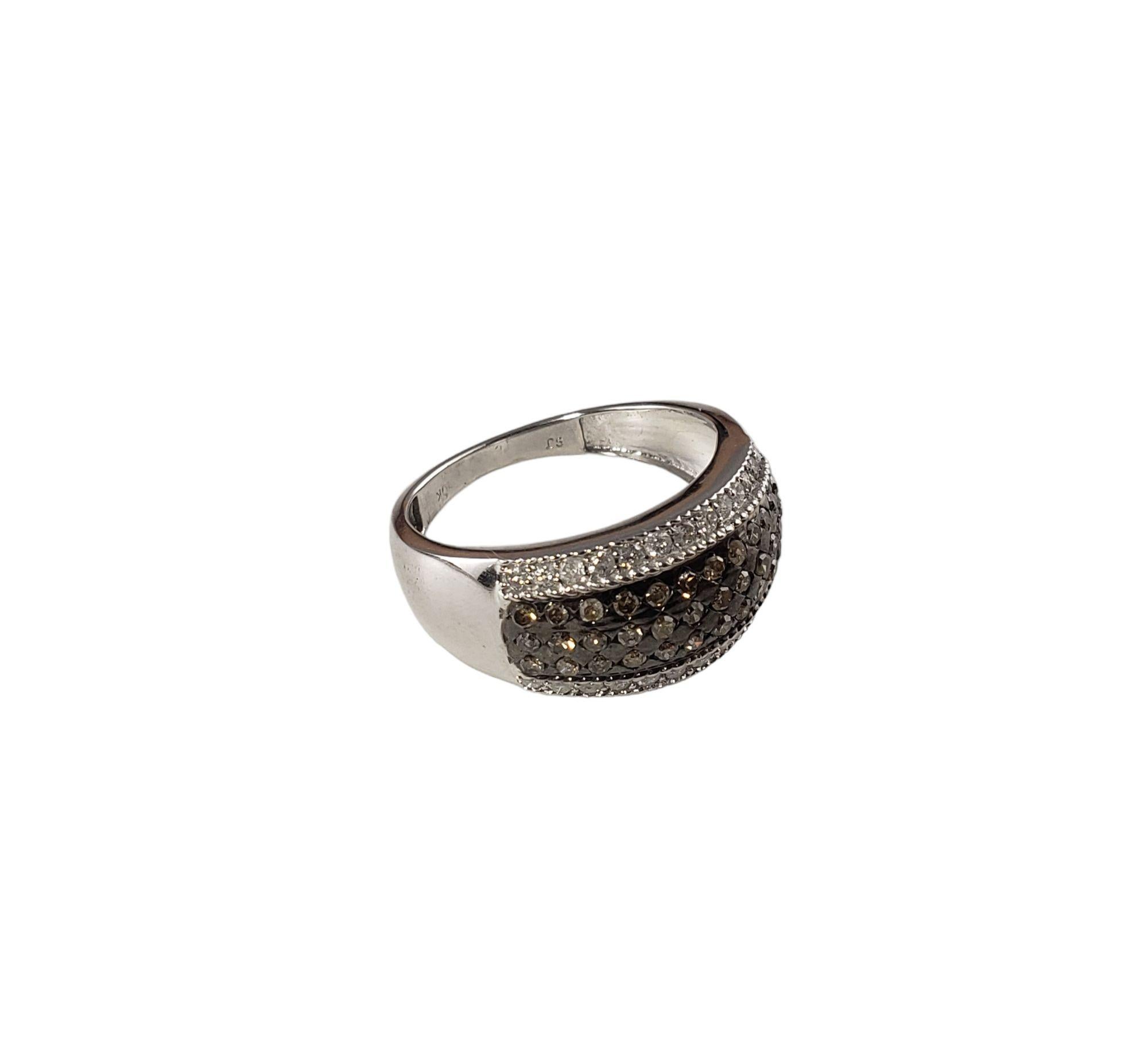 Vintage 10 Karat White Gold Brown and White Diamond Ring Size 8.25-

This sparkling ring features 36 brown round single cut diamonds and 26 white round single cut diamonds set in classic 10K white gold. Width: 10 mm. Shank: 2 mm.

Total diamond