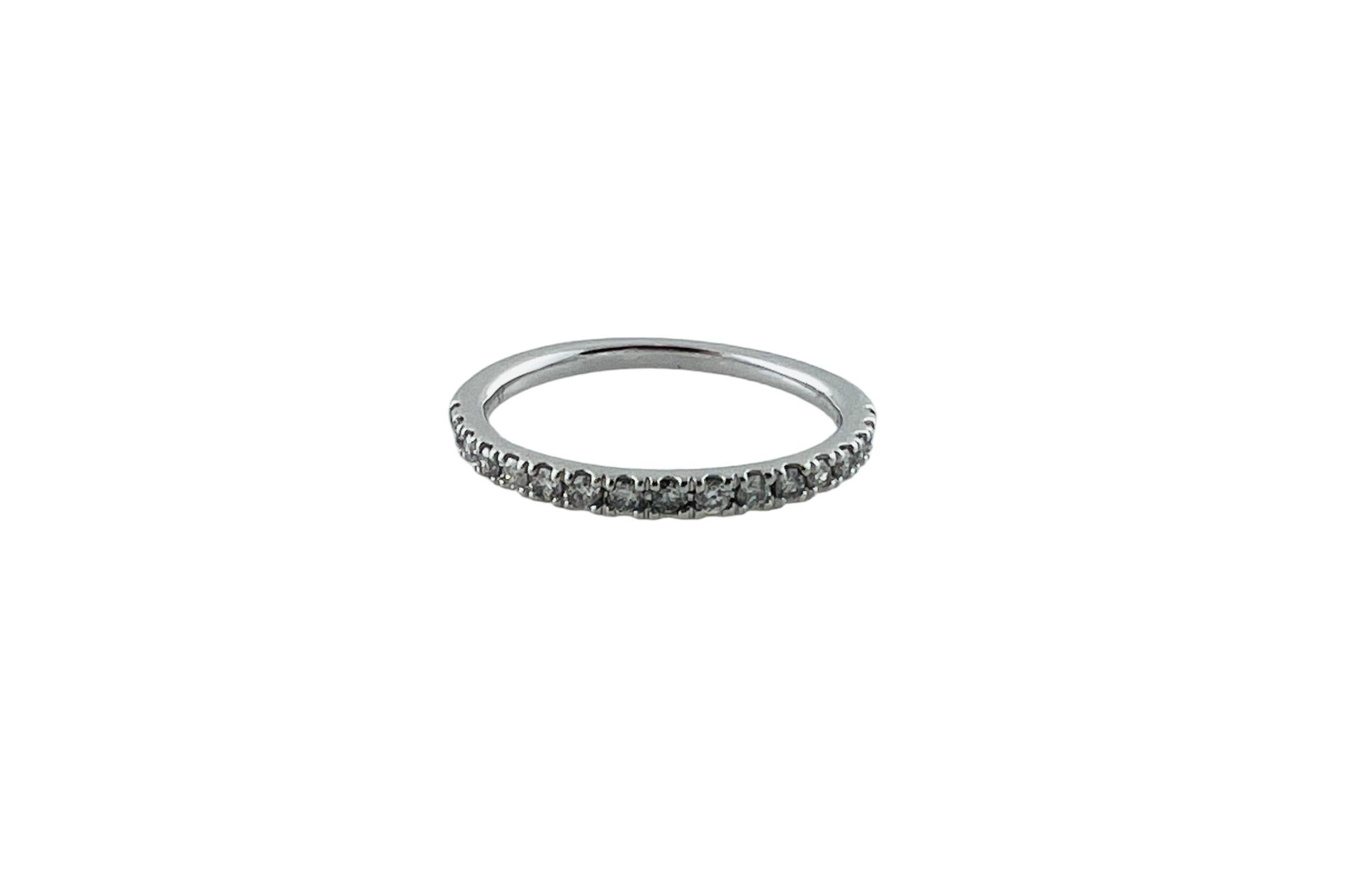 10 Karat White Gold Diamond Band Ring size 5.5-

This sparkling band features 17 round brilliant cut diamonds set in classic 10K white gold.  Width:  2 mm.  Shank:  1.6 mm.

Approximate total diamond weight:  .20 ct.

Diamond clarity: