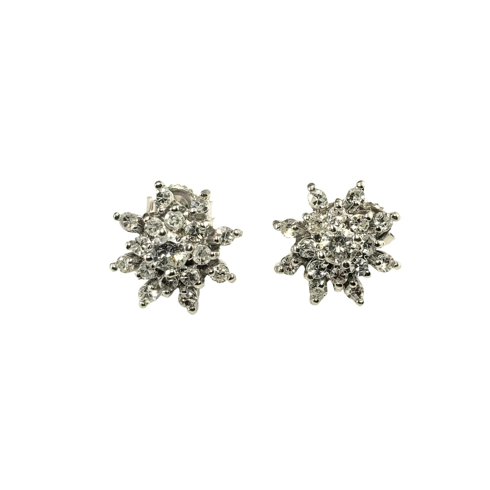 Vintage 10K White Gold Diamond Cluster Earrings-

These sparkling earrings each feature 16 round single cut diamonds and one round brilliant cut diamond set in classic 10K white gold.  Push back closures.

Approximate total diamond weight: .58