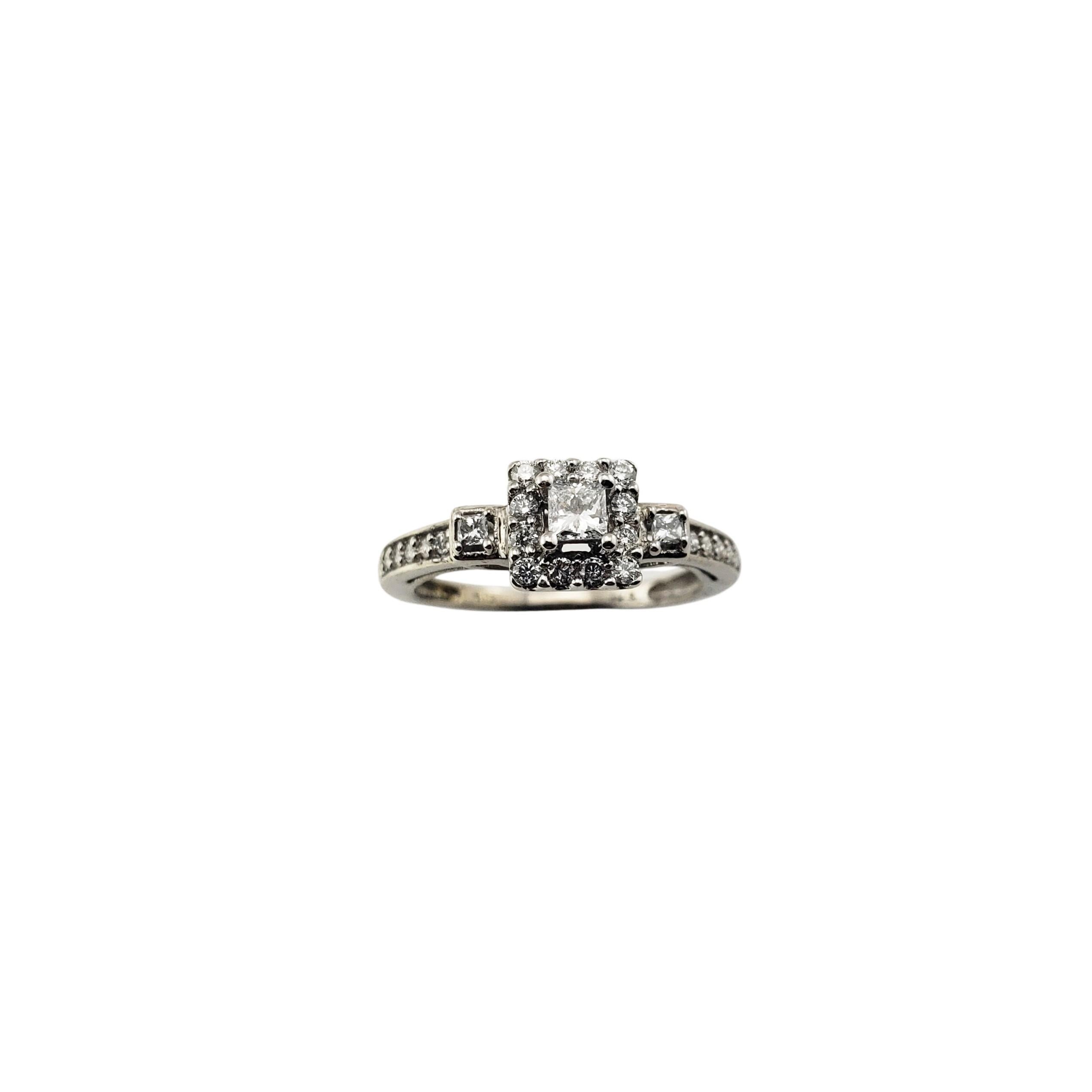 10 Karat White Gold Diamond Engagement Ring Size 5.5-

This sparkling ring features three princess cut diamonds (.03 ct., .12 ct., .03 ct.) and 22 round brilliant cut diamonds set in classic 10K white gold.  Width:  7 mm.  Shank:  1.5
