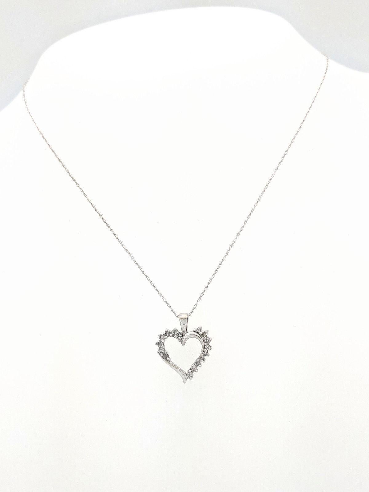 10K White Gold Diamond Heart Pendant Necklace

HJL:2018.526

You are viewing a Beautiful Diamond Heart Pendant Necklace. The piece is crafted from 10k white gold and weighs 1 gram. It features (16) .01ct round brilliant cut diamonds for an estimated