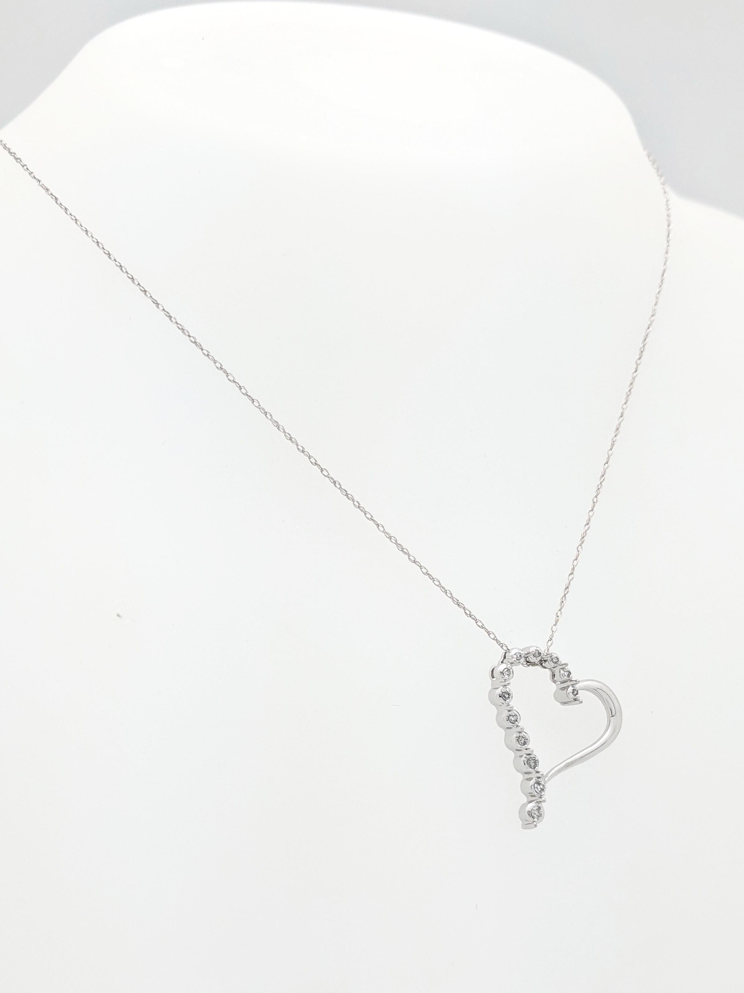 10K White Gold Diamond Heart Pendant Necklace

You are viewing a beautiful diamond heart pendant necklace. The piece is crafted from 10k white gold and weighs 2.2 gram. It features (12) natural round brilliant cut diamonds for an estimated .07ctw.