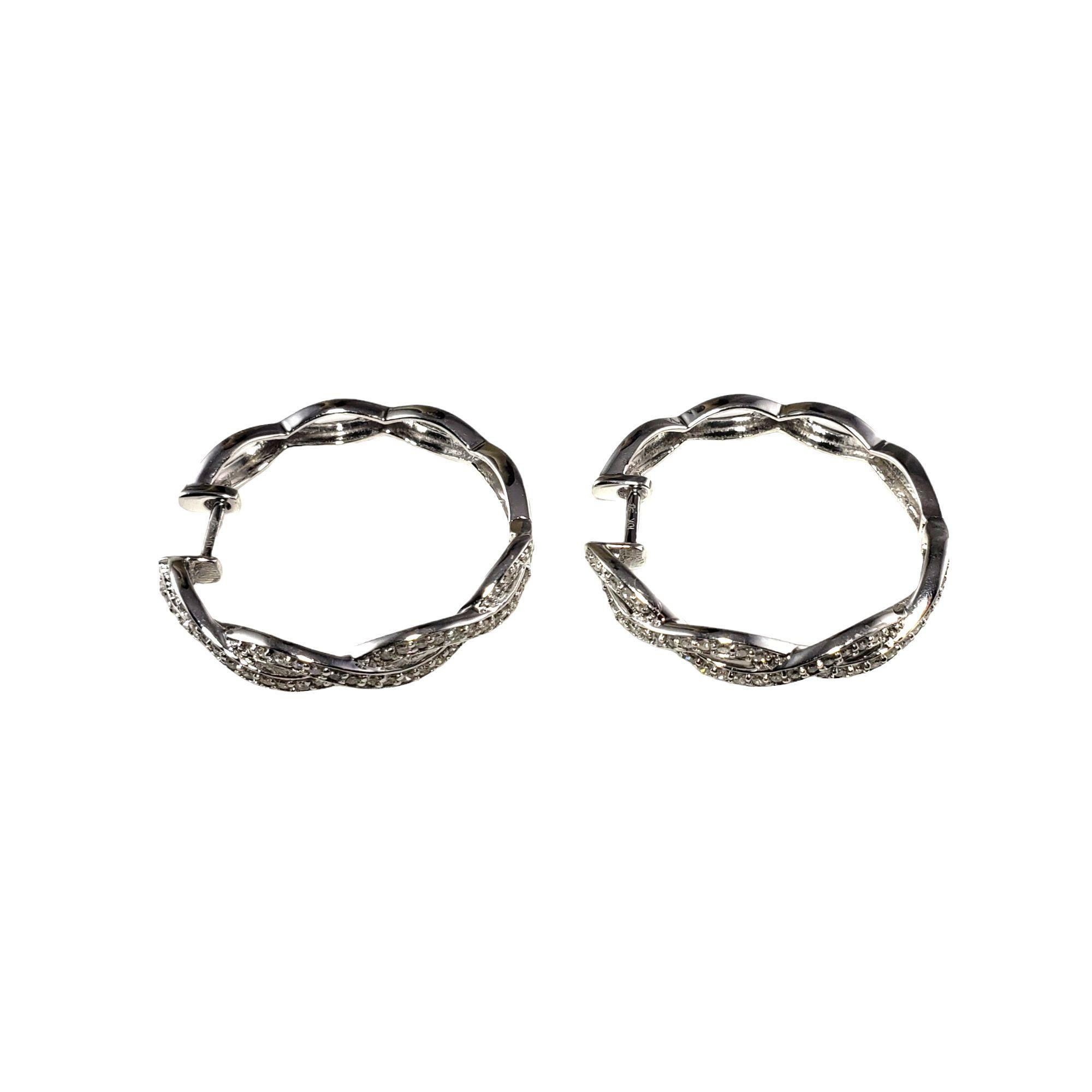 Vintage 10 Karat White Gold and Diamond Hoop Earrings-

These sparkling hoop earrings each feature 48 round single cut diamonds set in classic 10K white gold.

Approximate diamond weight: .50 ct.

Diamond color: I-J

Diamond clarity: SI1

Size: 25