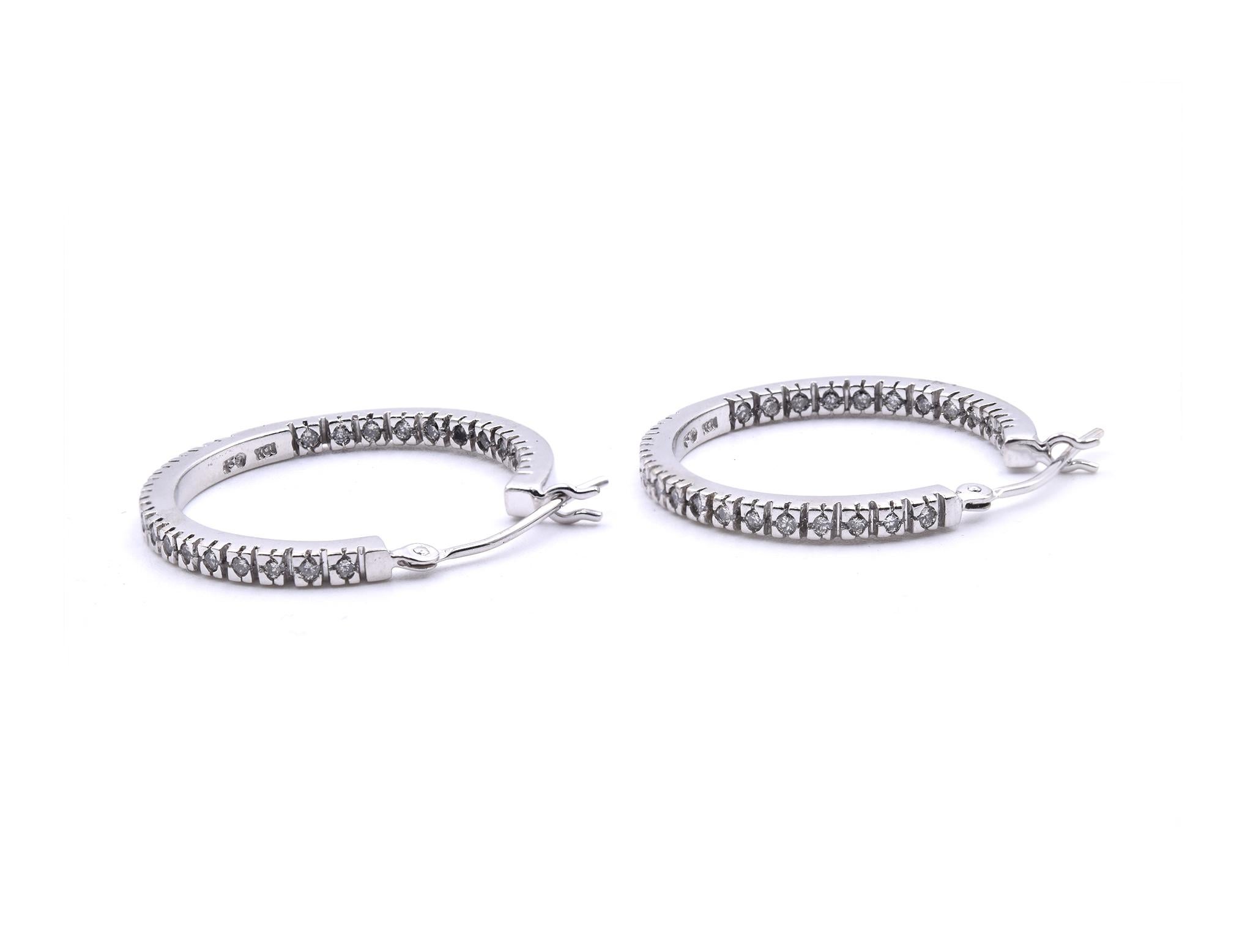 Material: 10K white gold
Diamonds: 52 round brilliant cuts = .52cttw
Color: H
Clarity: SI1
Dimensions: earrings measure 23mm X 2mm
Fastenings: snap closures
Weight: 4.43 grams
