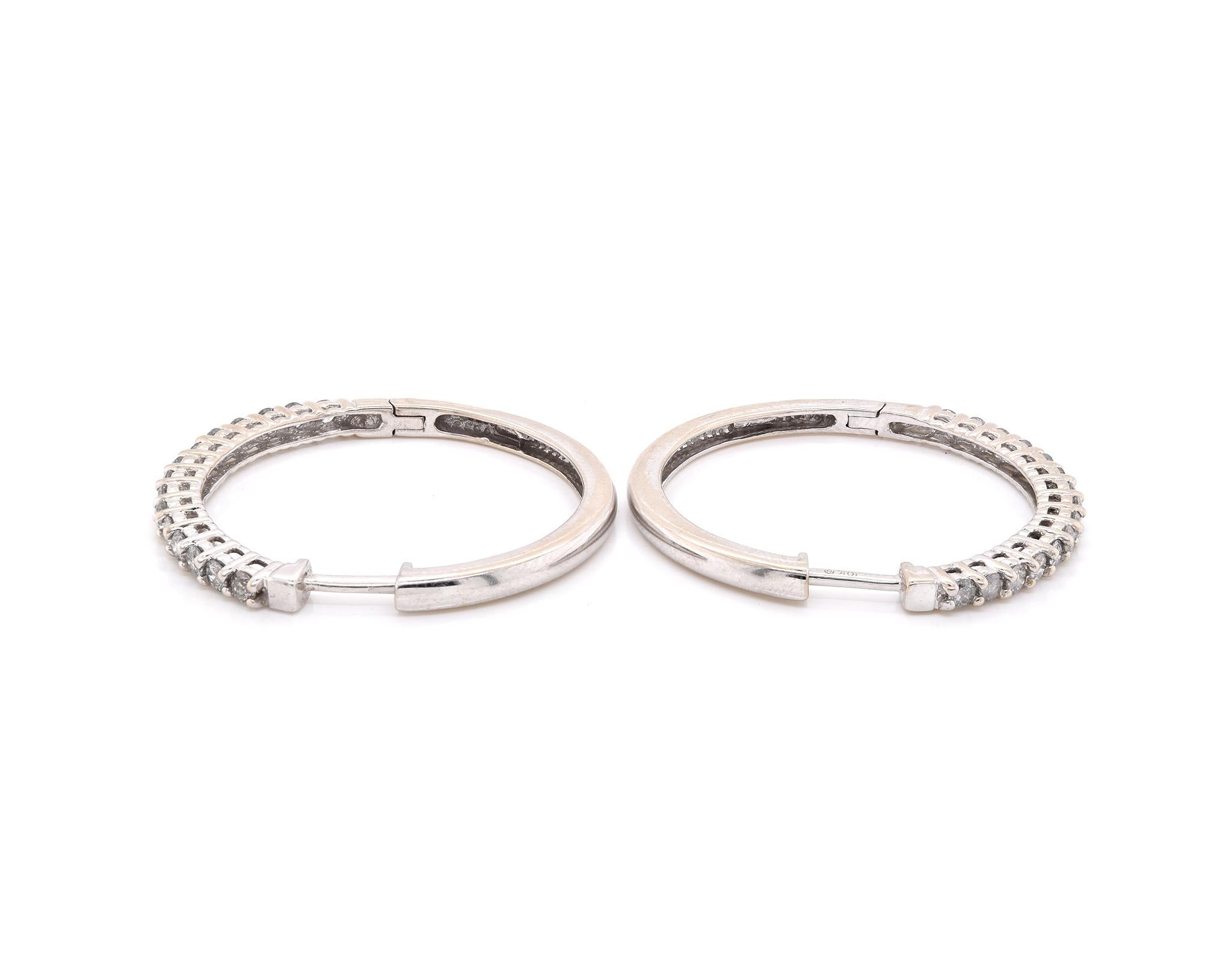 Designer: custom
Material: 10K white gold
Diamonds: 30 round briliant cut = 1.50cttw
Color: H
Clarity: SI2
Dimensions: earrings measure 33mm long
Weight: 8.00 grams
